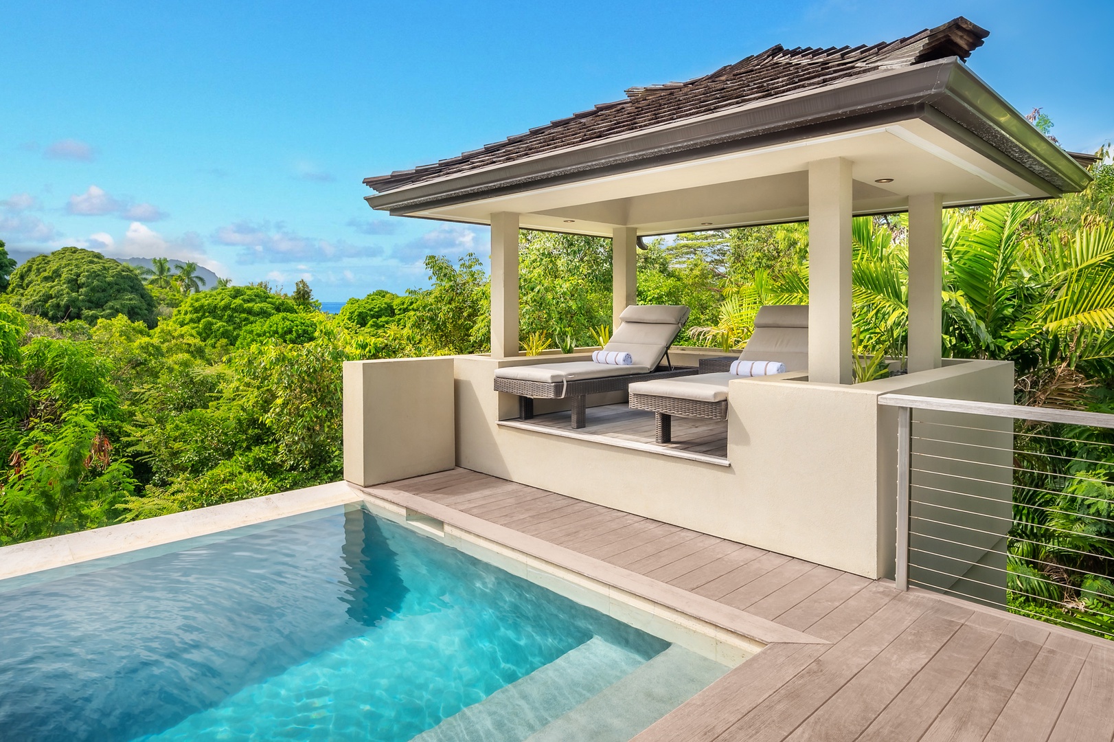 Princeville Vacation Rentals, Hanalei Plantation Villa - Lounge on the chaise loungers in the poolside cabana.