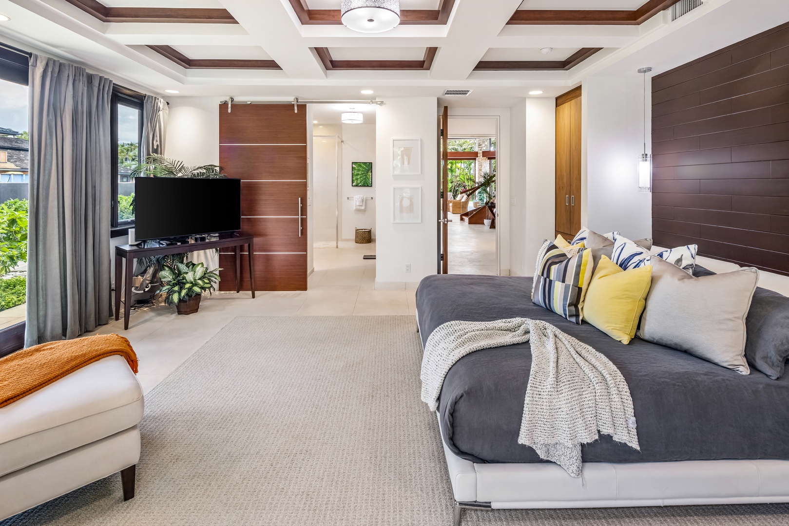 Honolulu Vacation Rentals, Kahala Grand Splendor - The downstairs guest suite showcases a king bed, beautiful coffered ceilings, and a refined aesthetic.