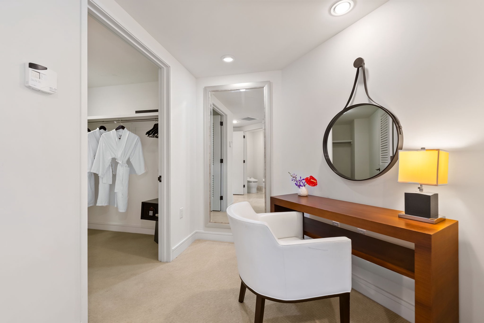 Honolulu Vacation Rentals, Kala'i 3203 - Elegant primary dressing area with a large mirror and walk-in closet for a touch of luxury.