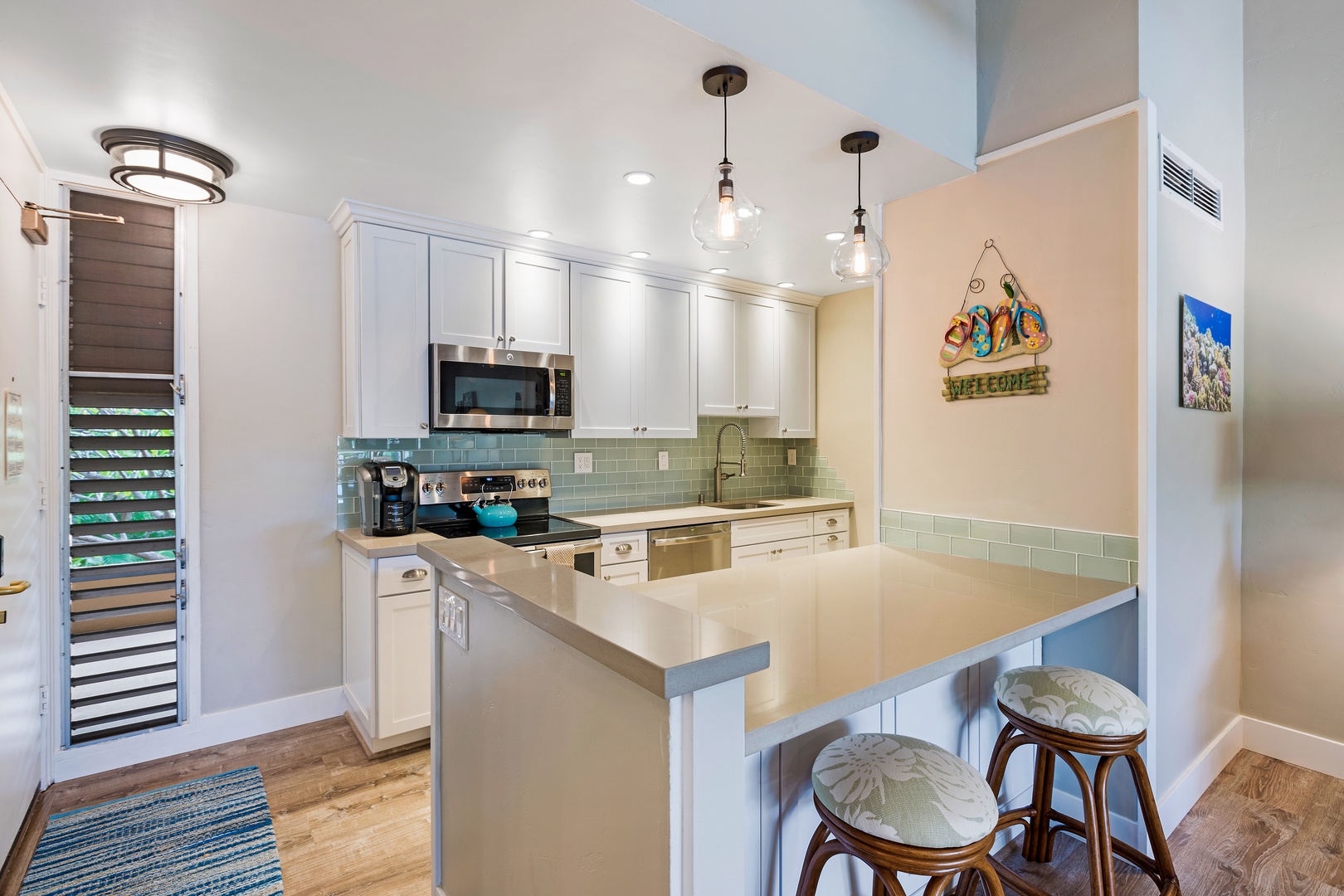 Lahaina Vacation Rentals, Maui Kaanapali Villas 292 - Maui Kaanapali Villas 292’s kitchen has bar seating, stainless steel appliances, and island charm.