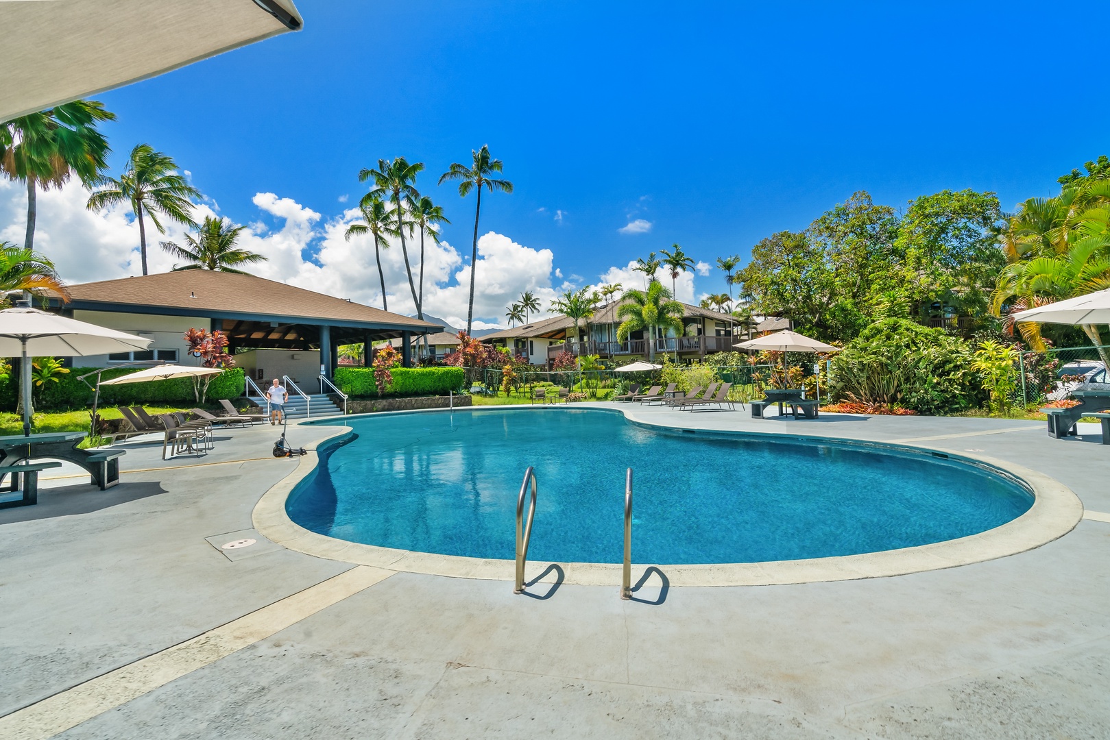 Princeville Vacation Rentals, Mauna Kai 7B - Laps before breakfast, the pool quiet and yours for the early hour.
