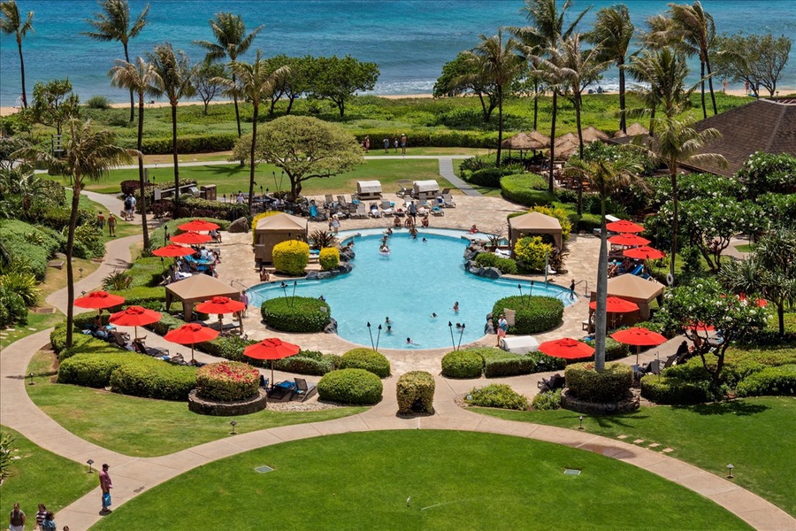 Lahaina Vacation Rentals, Honua Kai Hokulani 214 - Enjoy a refreshing dip in the resort's pool, surrounded by lush tropical landscaping and ocean views.