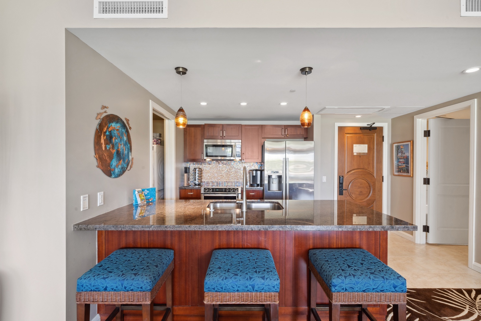 Lahaina Vacation Rentals, Honua Kai Konea 204 - Start your day with fresh coffee at the kitchen island of Honua Kai Konea 204, complete with barstool seating.