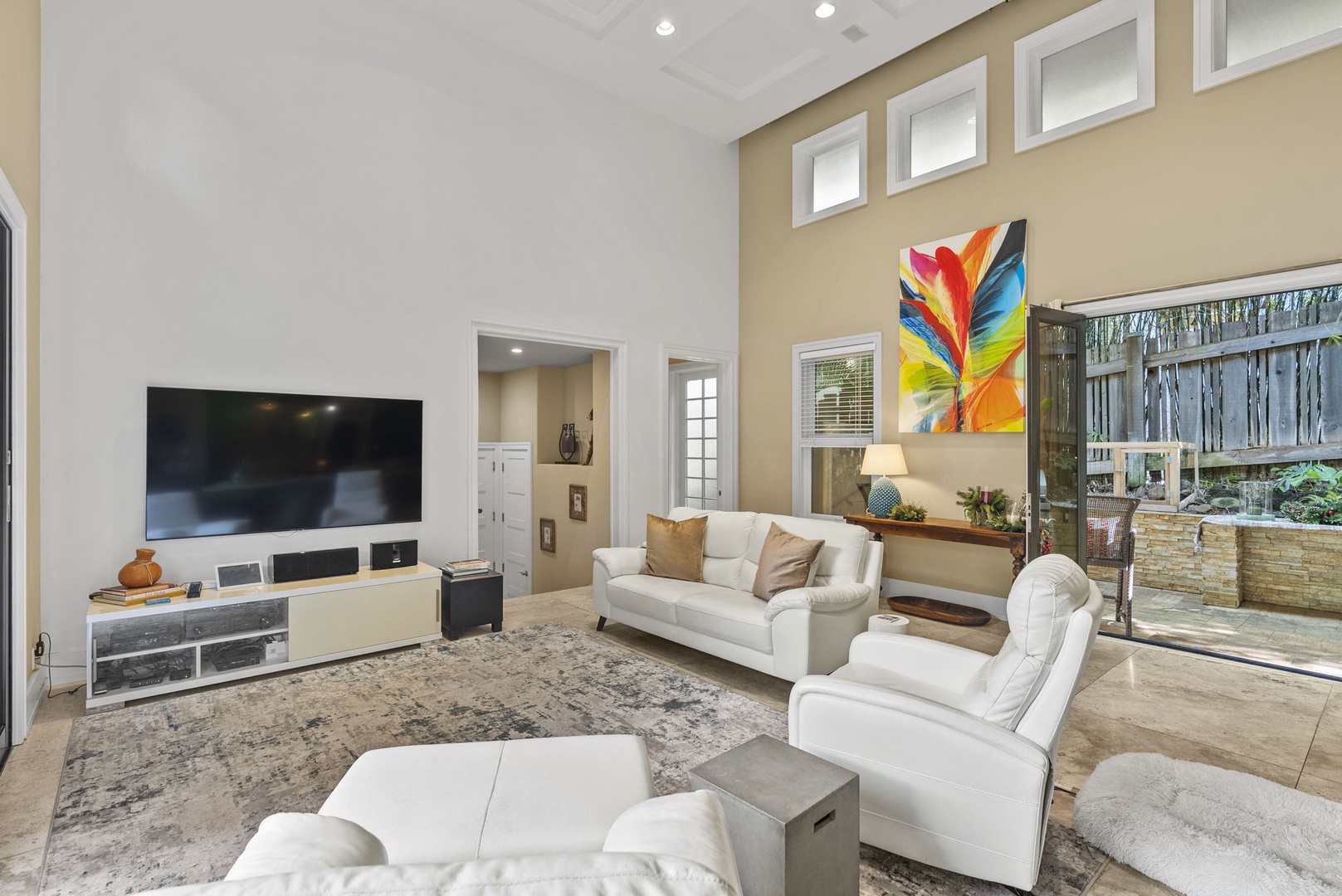 Honolulu Vacation Rentals, Pili Pono - Living room adorned with tropical accents and flat screen TV.