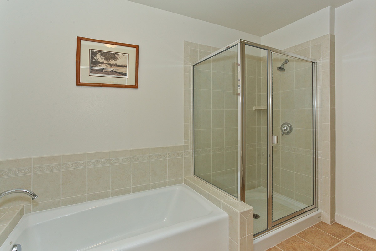 Kapolei Vacation Rentals, Kai Lani 12D - Soak in the luxurious bathtub in the primary guest bathroom.
