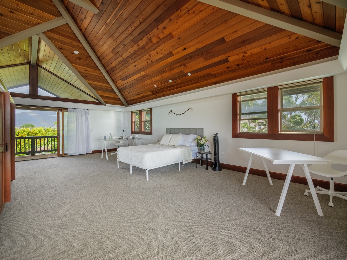 Waianae Vacation Rentals, Konishiki Beachhouse - Primary suite with a dedicated workspace and private deck.
