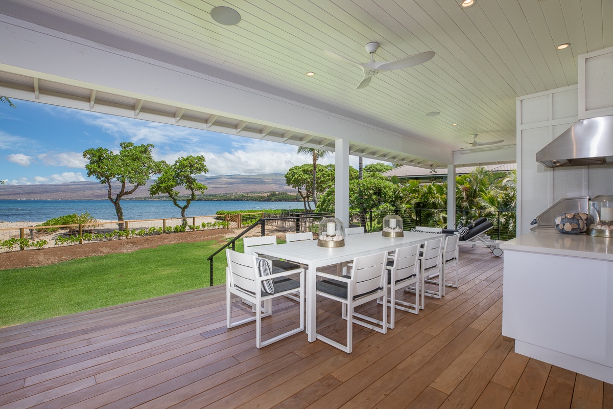 Kamuela Vacation Rentals, Puako Beach Getaway - Relax in the shade on the oceanfront lanai, where you can enjoy peaceful mornings and spectacular sunsets.