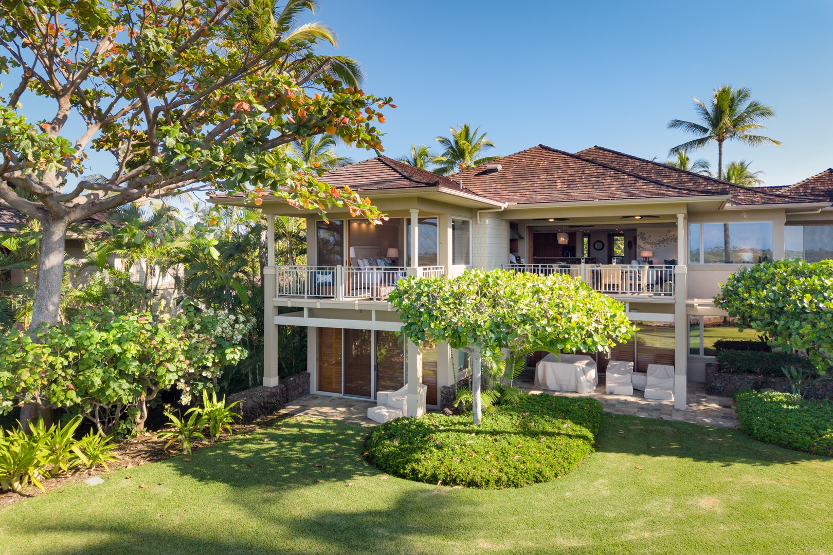 Kailua Kona Vacation Rentals, 3BD Waiulu Villa (111D) at Hualalai Resort - Tropical paradise villa featuring lush landscaping, palm trees, and spacious outdoor lanai in a pristine resort setting.