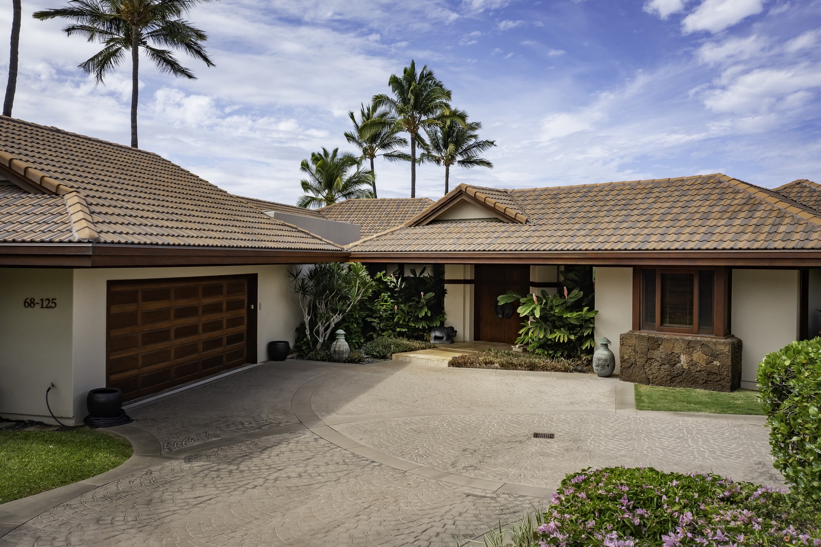 Kamuela Vacation Rentals, Champion Ridge 7 - Elegant tropical property with circular driveway, lush landscaping, and swaying palm trees creating a peaceful island retreat atmosphere.