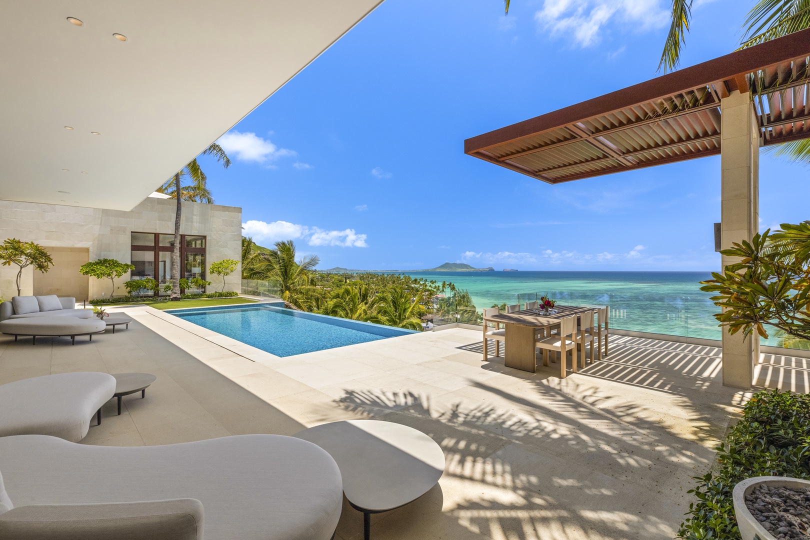 Kailua Vacation Rentals, Lanikai Hillside Estate - Poolside deck with comfortable seating and ocean views, offering a serene retreat.