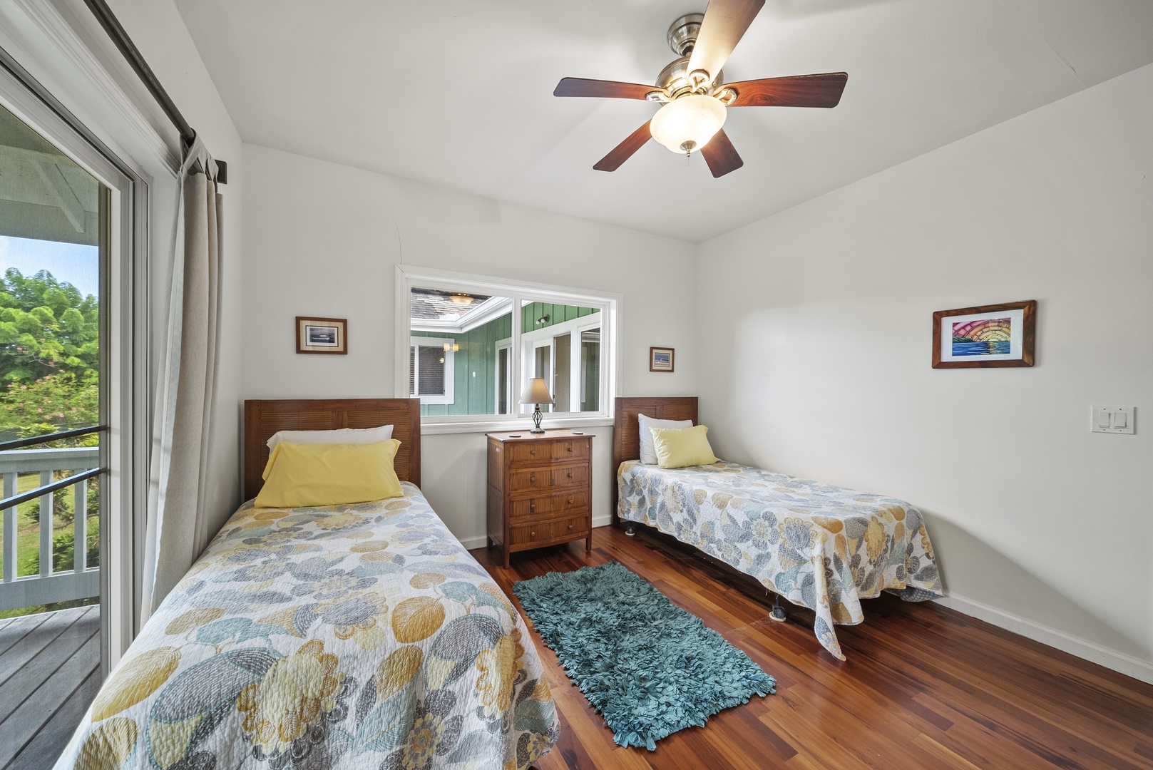 Haleiwa Vacation Rentals, North Shore Tropical Hale - Crisp linens, ceiling fan, and natural light combine in this relaxing twin bedroom designed for island-style comfort.