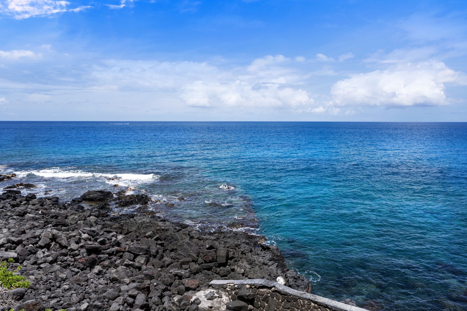 Kailua Kona Vacation Rentals, Sea Village 4213 - Rocky lava shoreline and vibrant blue waters just steps from your lanai—pure Big Island beauty.