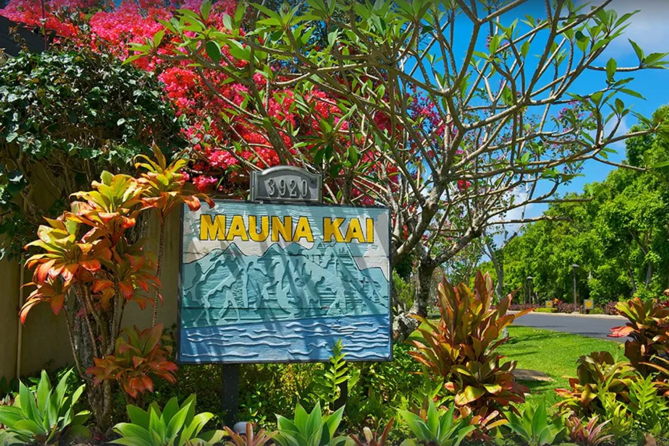 Princeville Vacation Rentals, Mauna Kai 11 - Lush landscaping and welcoming signage mark your arrival at Mauna Kai, Princeville's serene escape.*