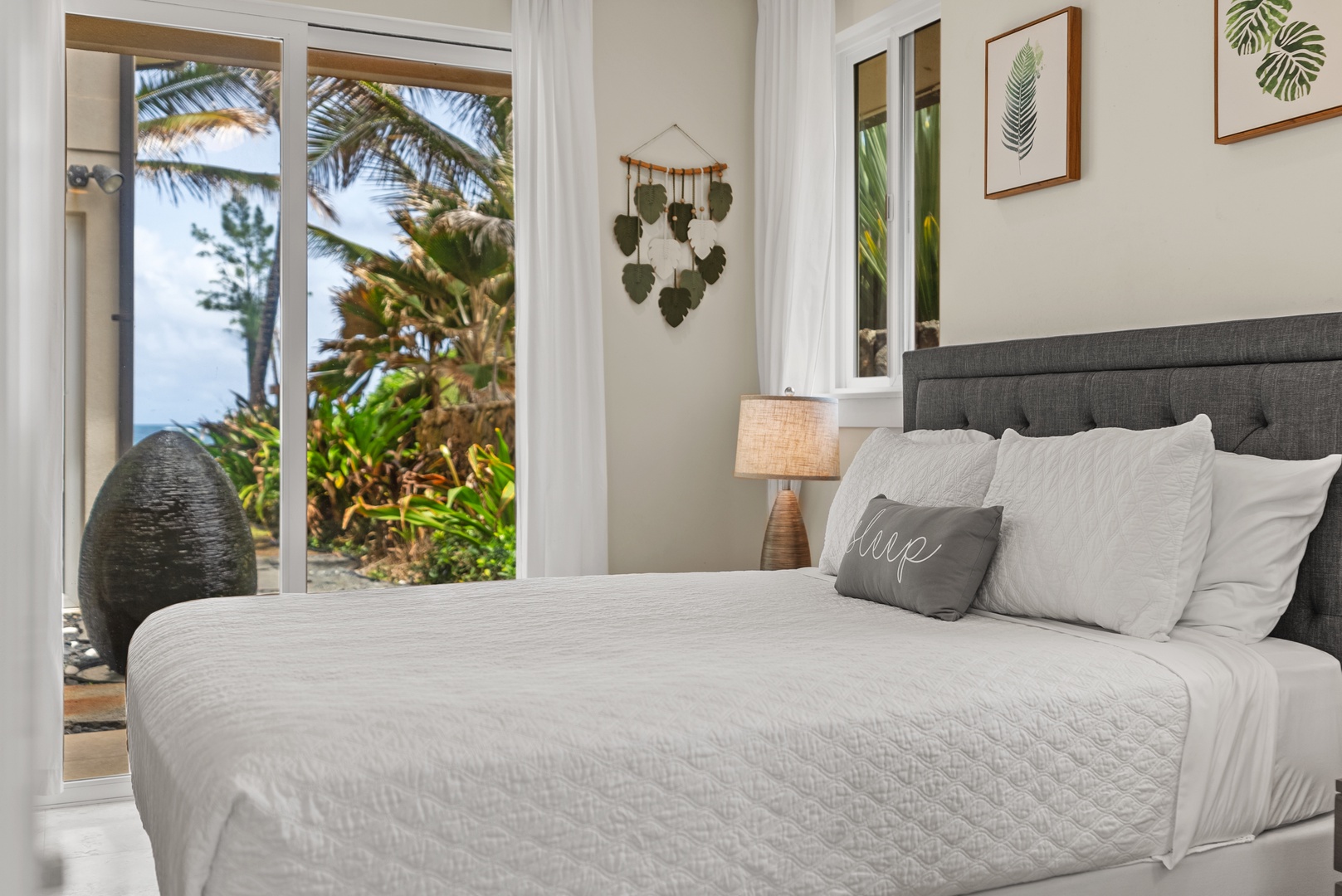 Laie Vacation Rentals, Laie Beachfront Estate - The lower-level bedroom with a queen bed and private lanai.