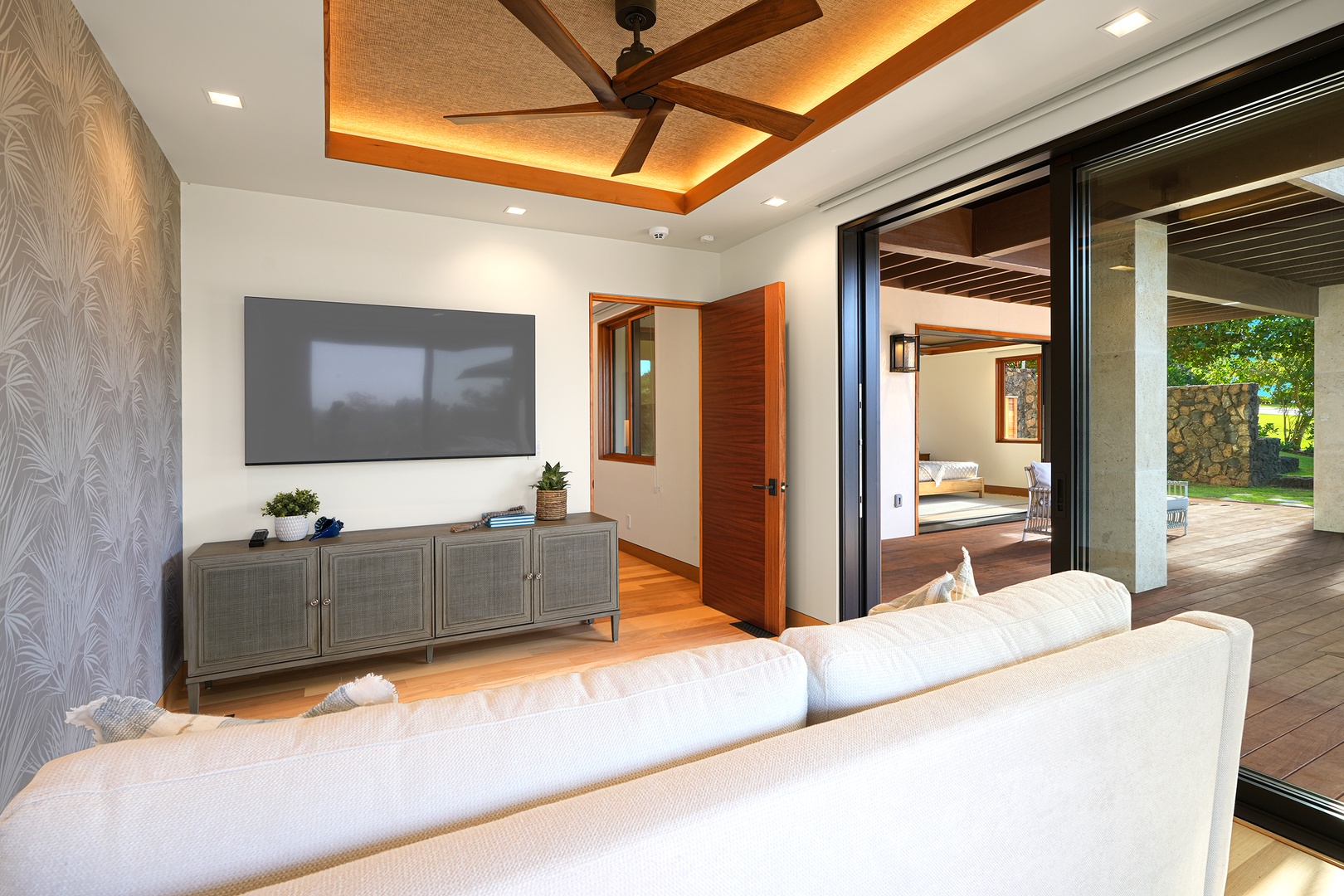 Koloa Vacation Rentals, Hale Kai‘opua at Kukui'ula - Cozy TV room with comfortable seating and seamless indoor-outdoor flow.