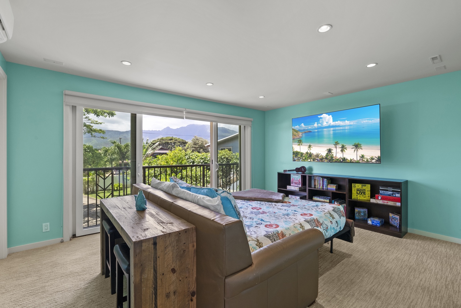 Waialua Vacation Rentals, Waialua Beachfront Getaway - Second-floor media room, with queen-size Tempur-Pedic pull-out bed