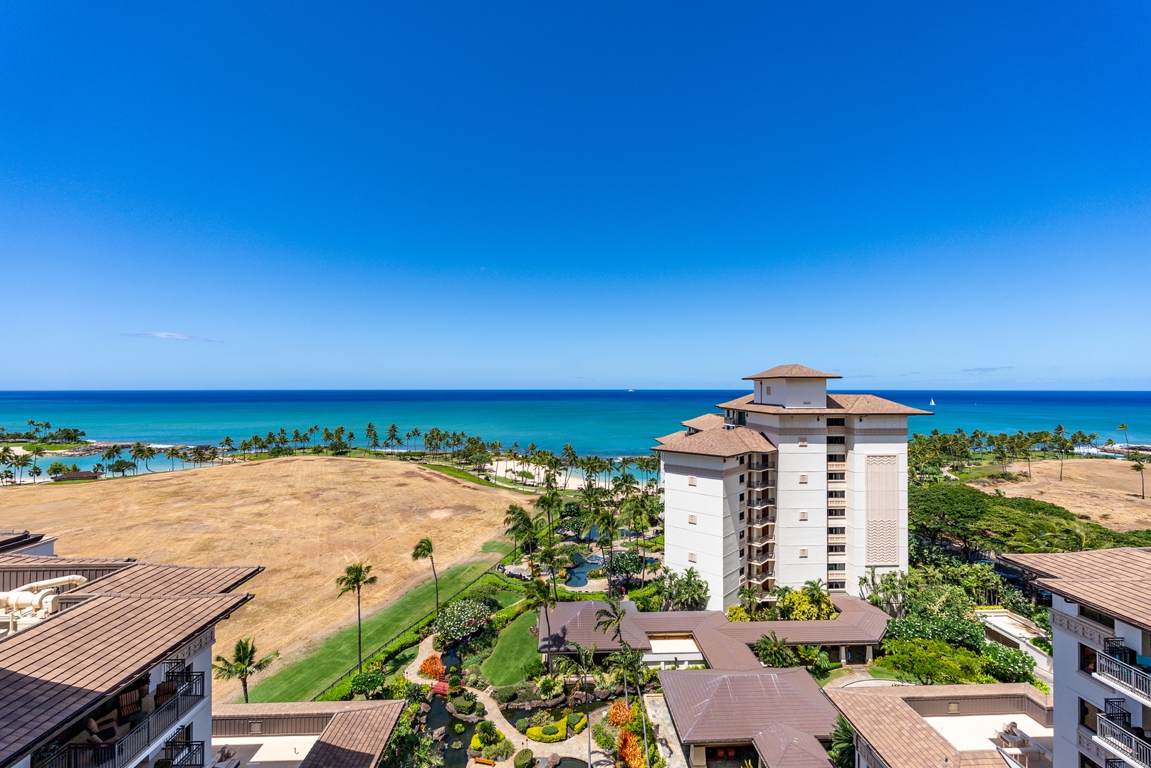 Kapolei Vacation Rentals, Ko Olina Beach Villas O1404 - Look south along the coast from up here, the lagoon and open ocean laid out below.