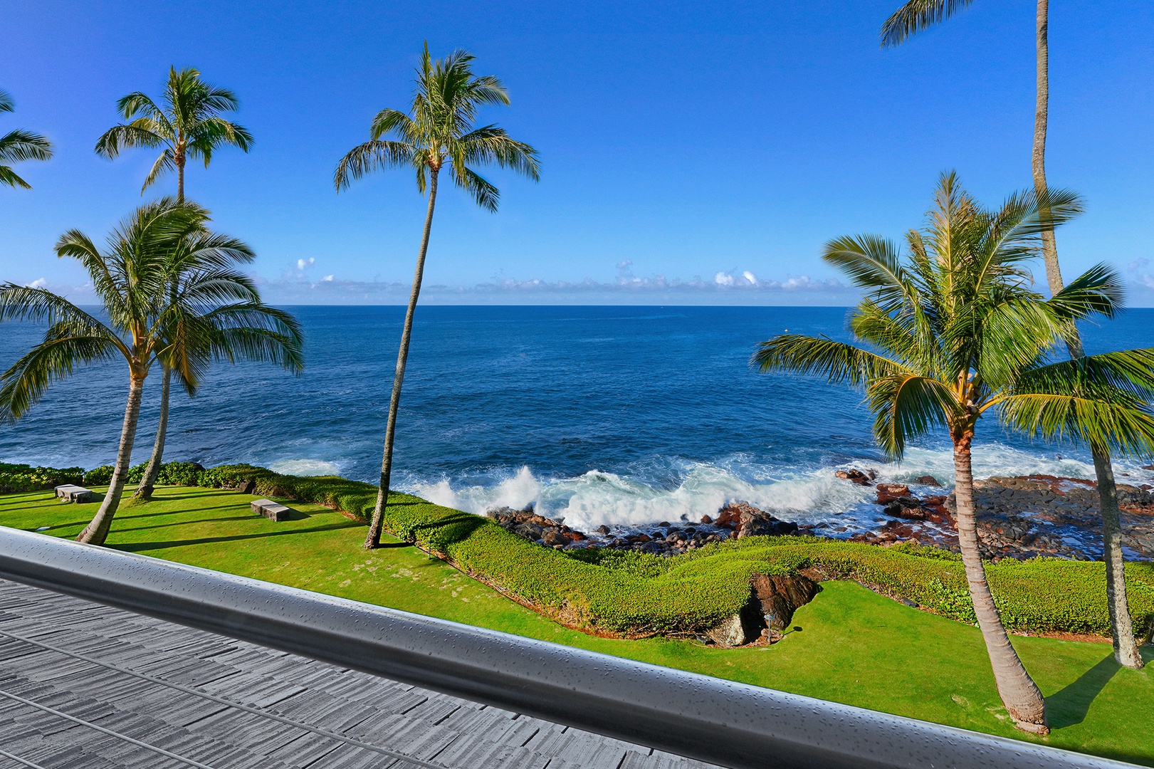 Koloa Vacation Rentals, Whalers Cove #133 - Gaze out at the lush lawn and crashing waves from your private balcony.