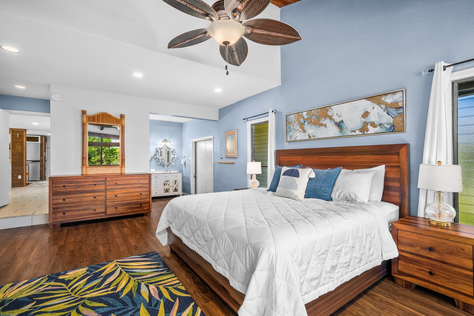 Princeville Vacation Rentals, Mauna Kai 7B - The primary bedroom claims its own corner, made for whoever wants the quiet.