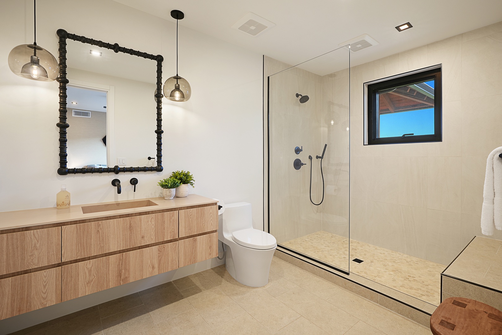 Koloa Vacation Rentals, Hale Hanohano at Kukuiula - Private spa-like bathroom with sleek glass shower and modern vanity—designed for comfort and ease during your stay.