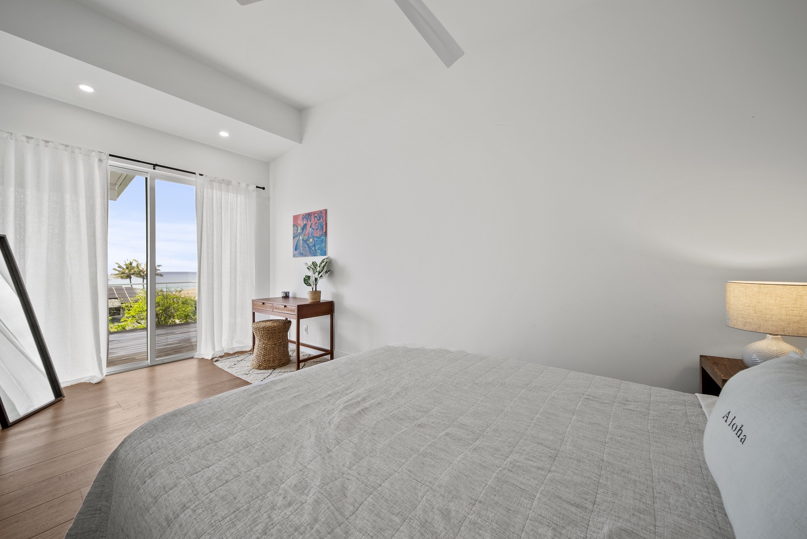 Haleiwa Vacation Rentals, Villa Bianca - The guest suite with glass sliders opens up to fresh air and natural light.