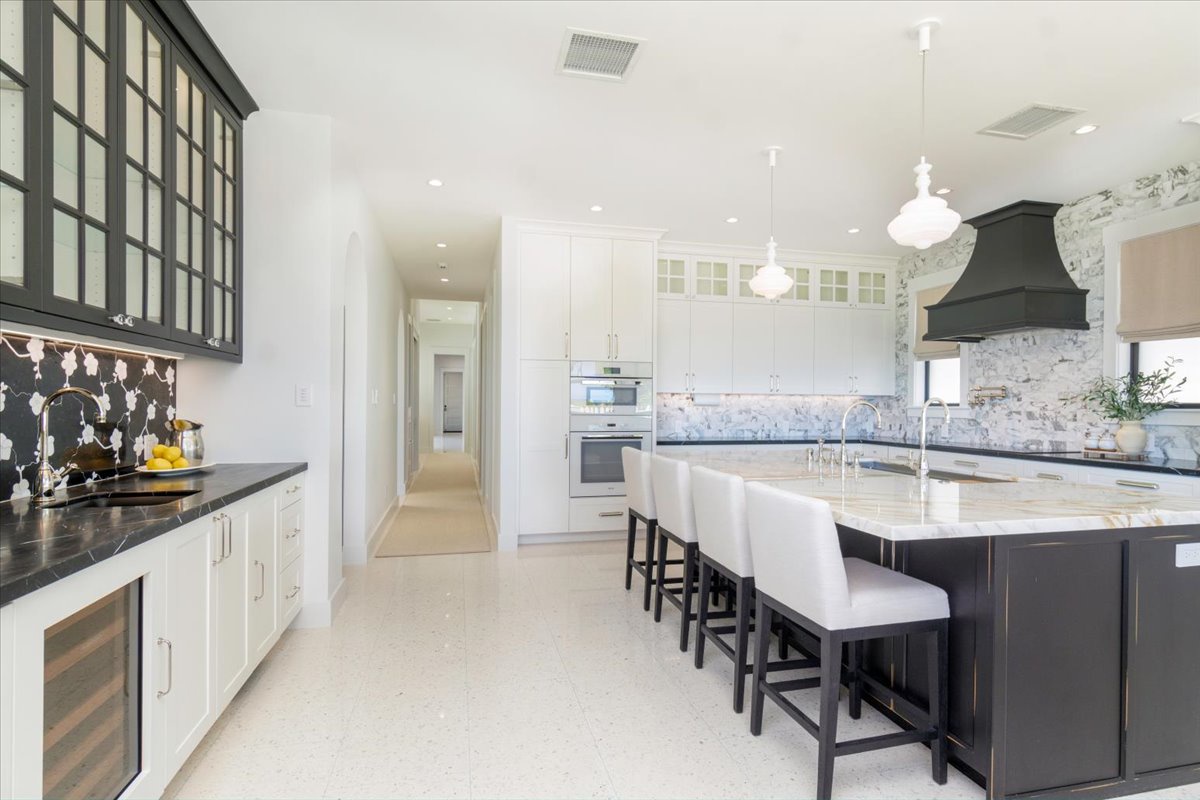 Kailua Vacation Rentals, Kailua Beachfront Estate - Full view of the chef-ready kitchen featuring premium appliances and custom finishes.