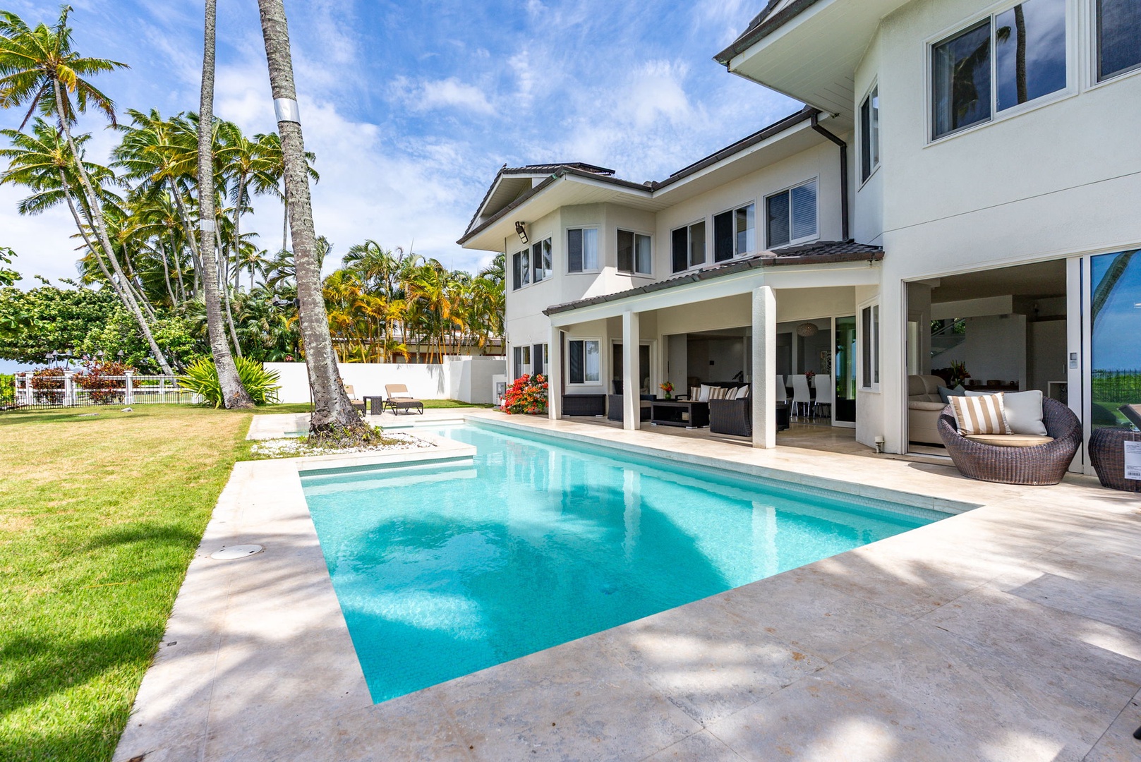 Honolulu Vacation Rentals, Paradise Beach Estate - The main residence wraps around the pool, creating a private resort-like courtyard just moments from the ocean.