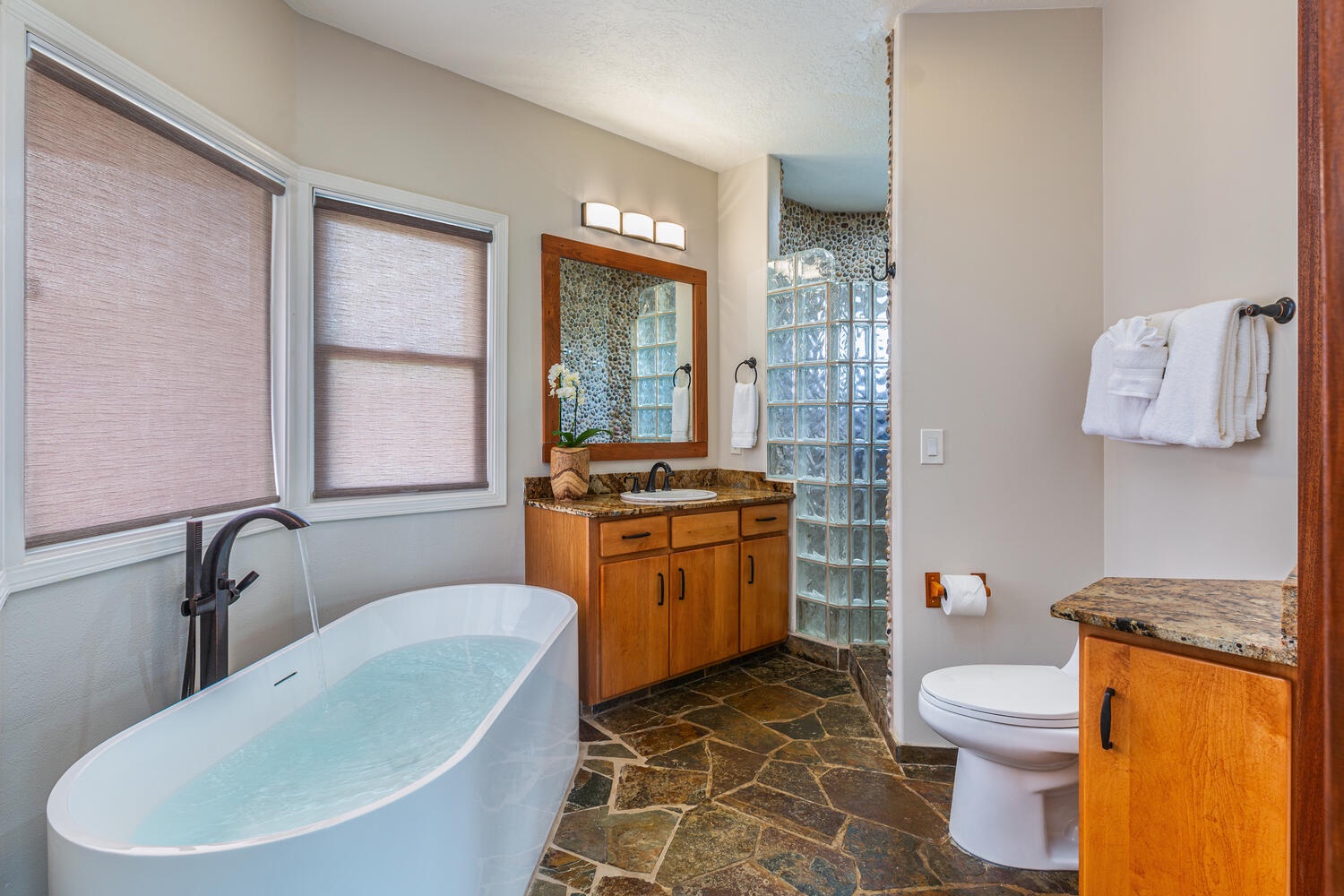 Princeville Vacation Rentals, Pohaku Villa - Soak up in the ensuite bathroom's large soaking tub with a view.