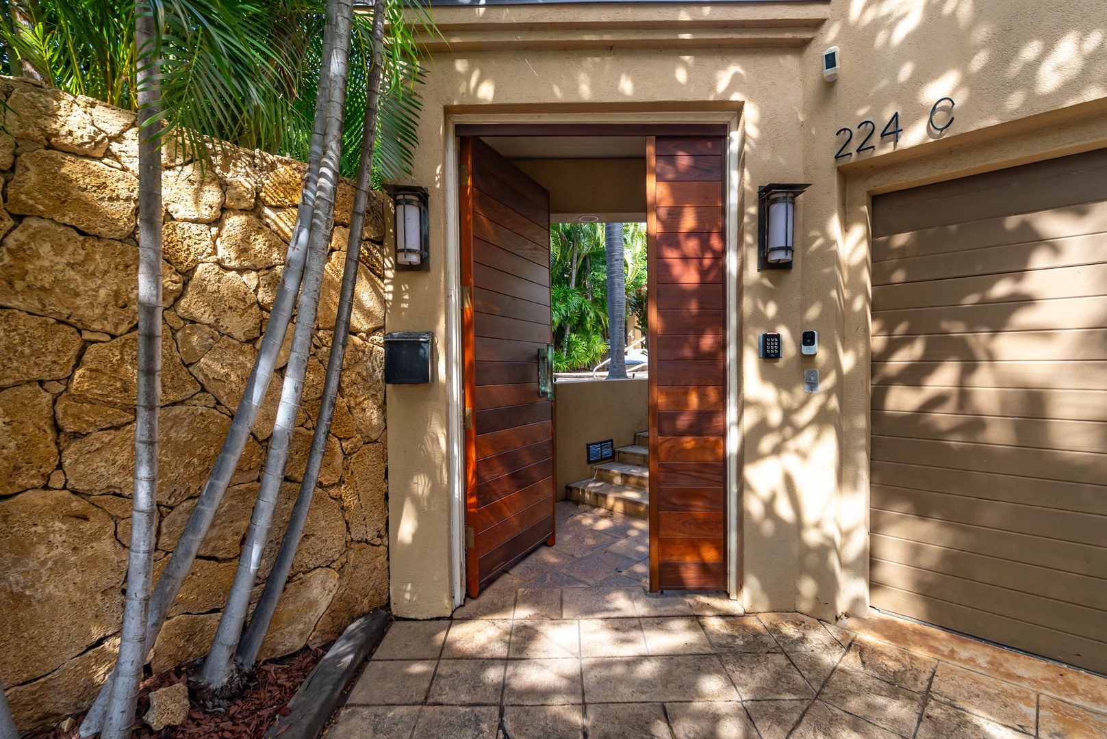 Honolulu Vacation Rentals, Diamond Head Luxe - Modern entrance with tropical landscaping creates a welcoming arrival at this beautifully designed property.