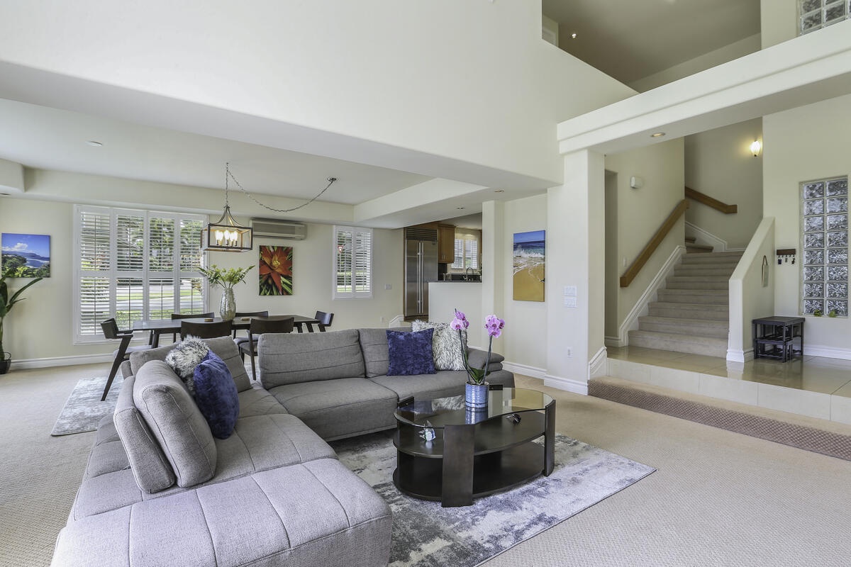 Princeville Vacation Rentals, Ho'onanea - Living room and stairs leading to the top floor