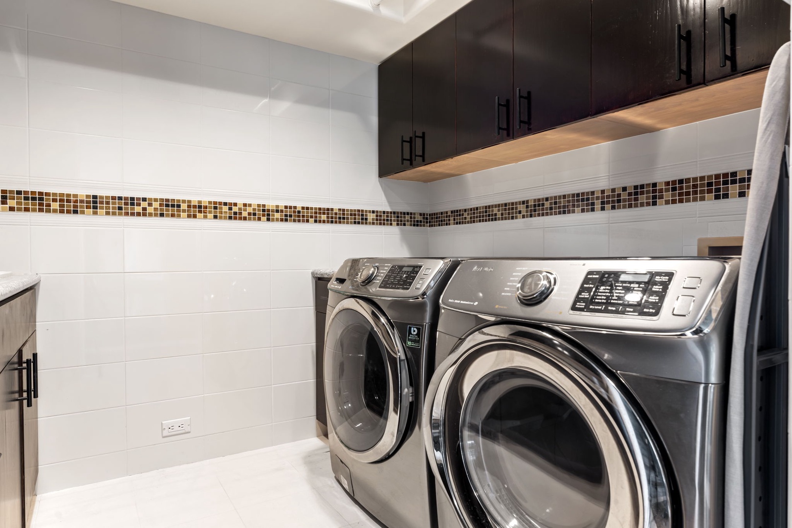 Kailua Kona Vacation Rentals, Hale Nai'a - Your dedicated laundry room features modern appliances and stylish storage, making it easy to keep your wardrobe fresh during your stay.
