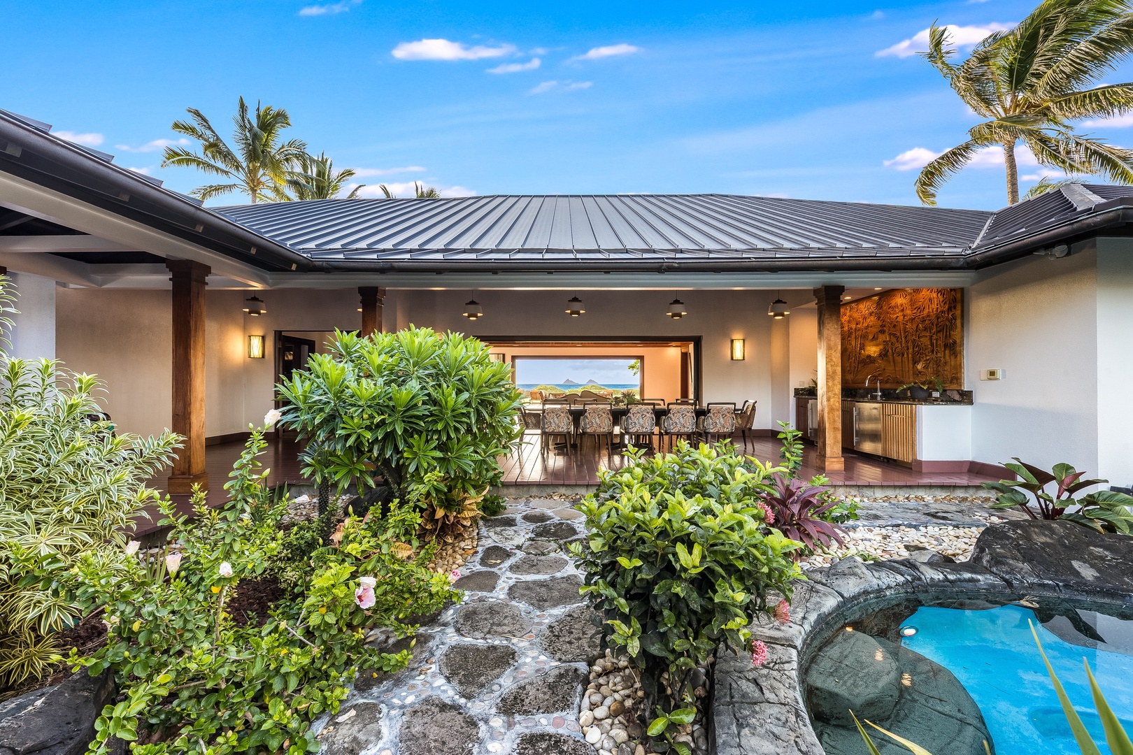 Kailua Vacation Rentals, Castle Point Estate - Private outdoor dining nook with garden and pond views — perfect for quiet mornings.