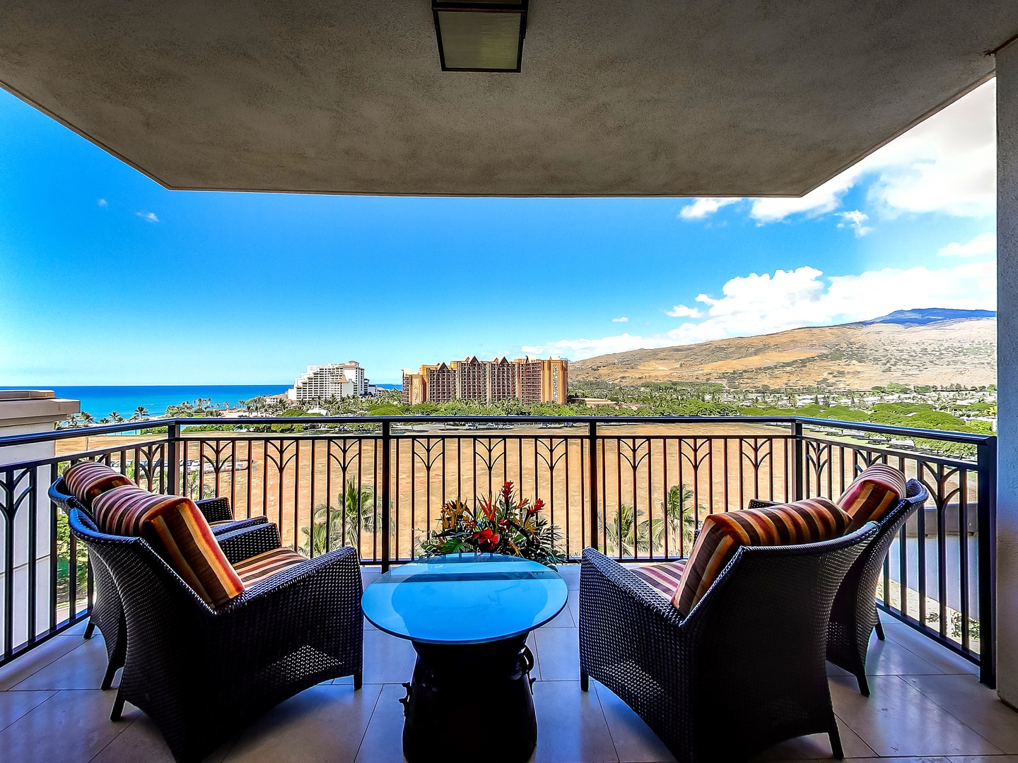 Kapolei Vacation Rentals, Ko Olina Beach Villas O1011 - Dining on the lanai with panoramic views of the island and sea.