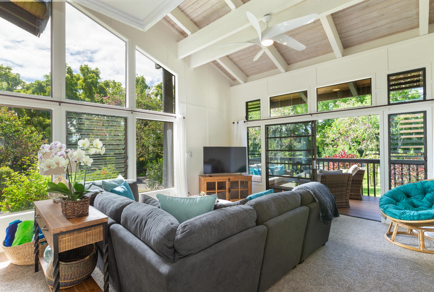 Princeville Vacation Rentals, Mauna Kai 2 - Living room looking out to the lanai