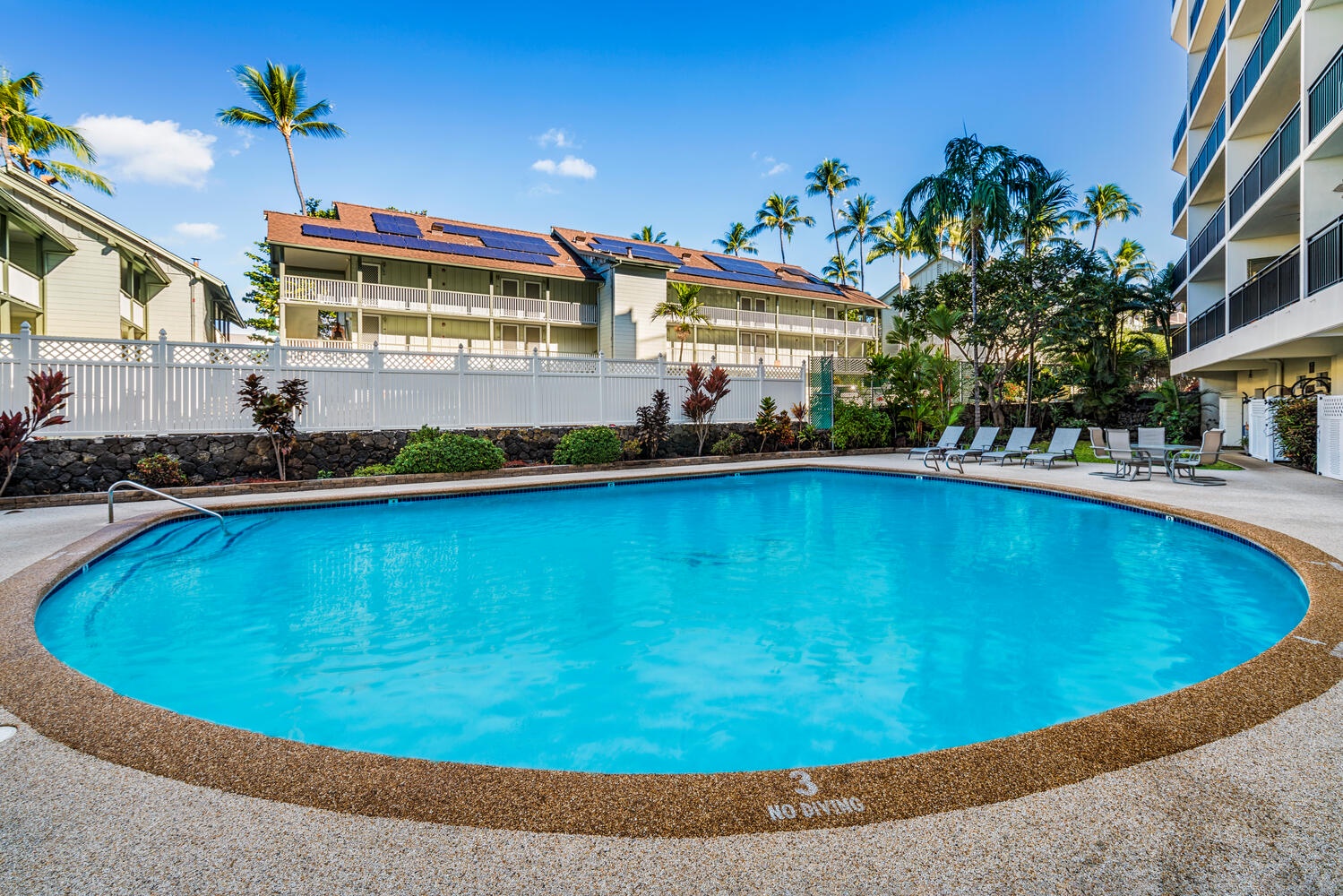 Kailua Kona Vacation Rentals, Kona Alii 302 - Kona Alii's pool with poolside loungers.