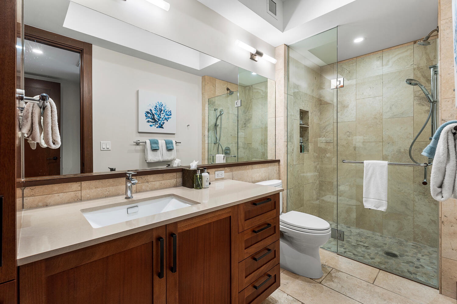 Kamuela Vacation Rentals, Laule'a Ohana Retreat - Stylish guest bathroom with walk-in shower and warm wood cabinetry at Laule'a #13.