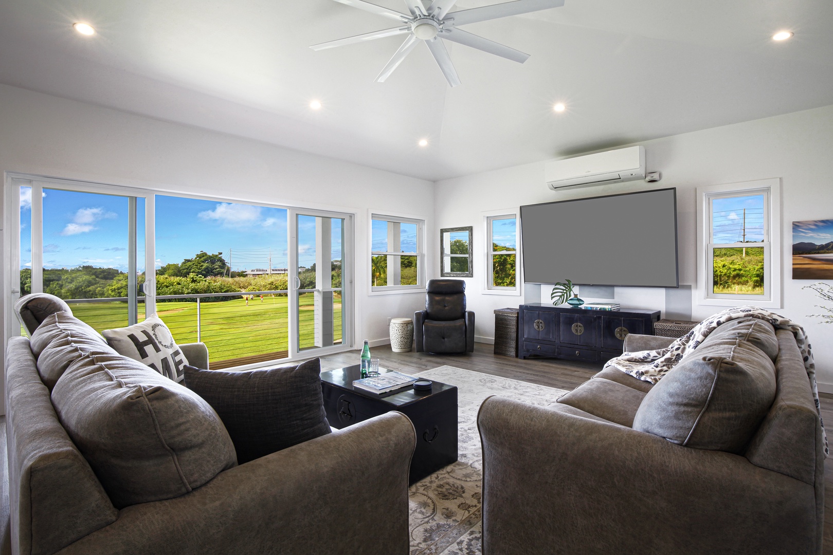 Koloa Vacation Rentals, Haupu Hale at Poipu - Cozy living room designed for comfort, featuring ample natural light and serene surroundings.