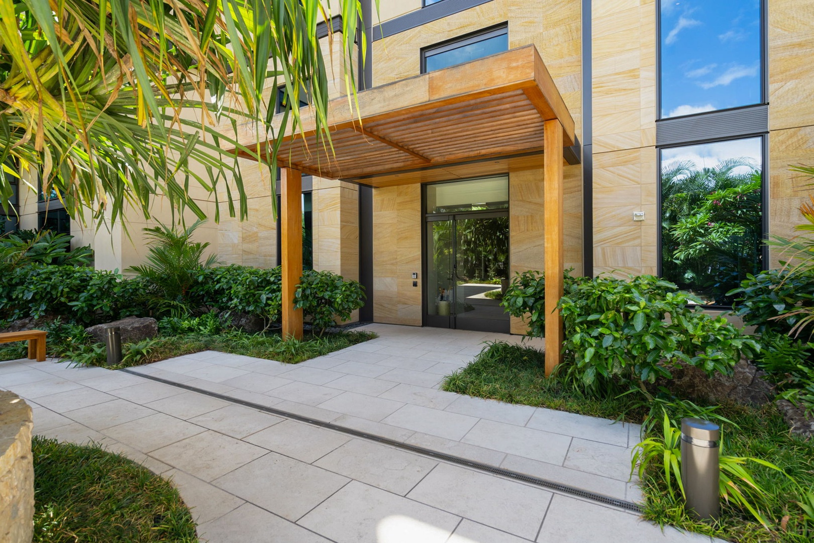 Honolulu Vacation Rentals, Park Lane Getaway - Welcoming entrance framed by tropical beauty at Park Lane.