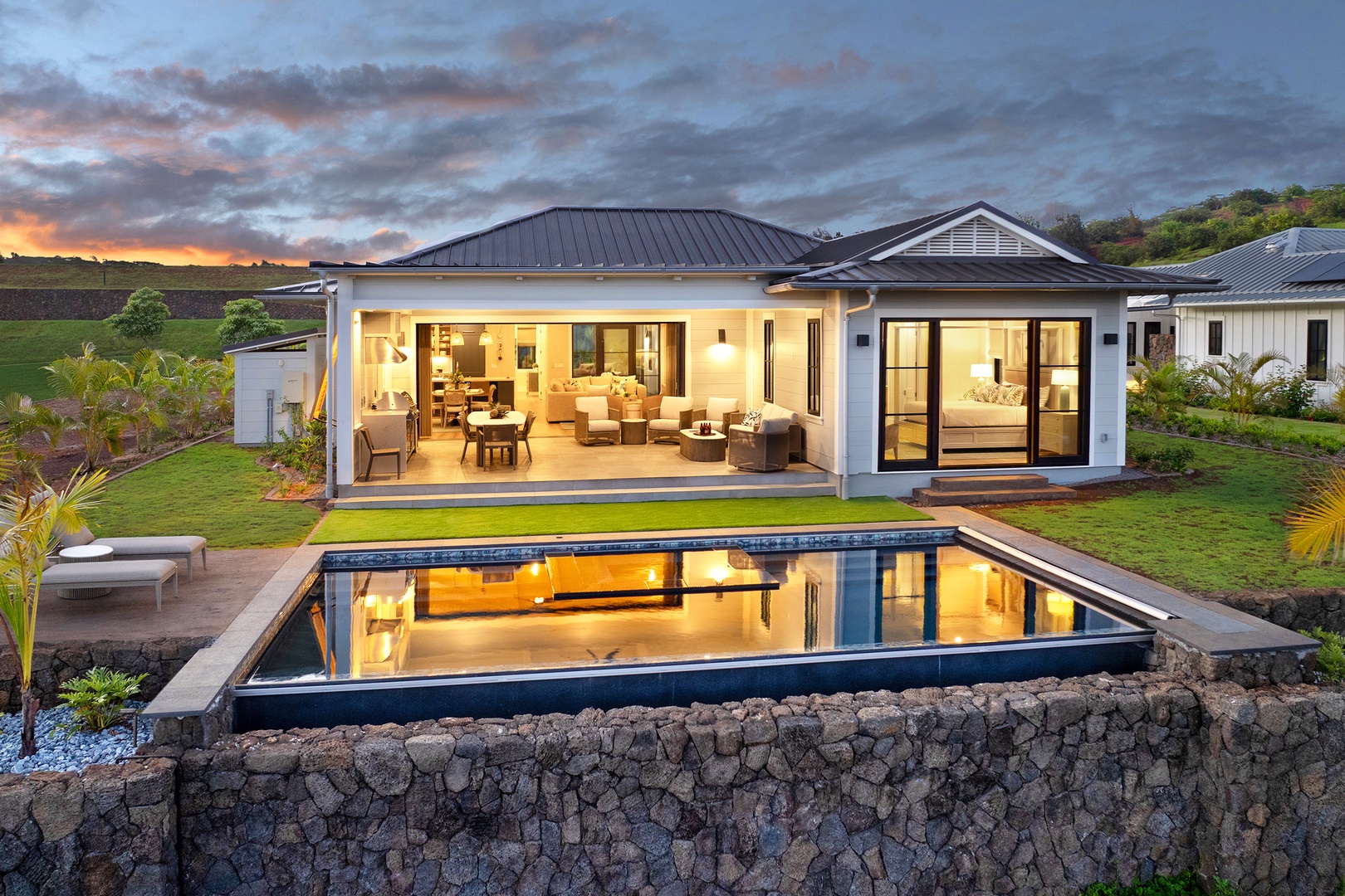 Koloa Vacation Rentals, Hali'a Mai - As the light fades, the home glows above its ocean-view pool on Kauai's South Shore.