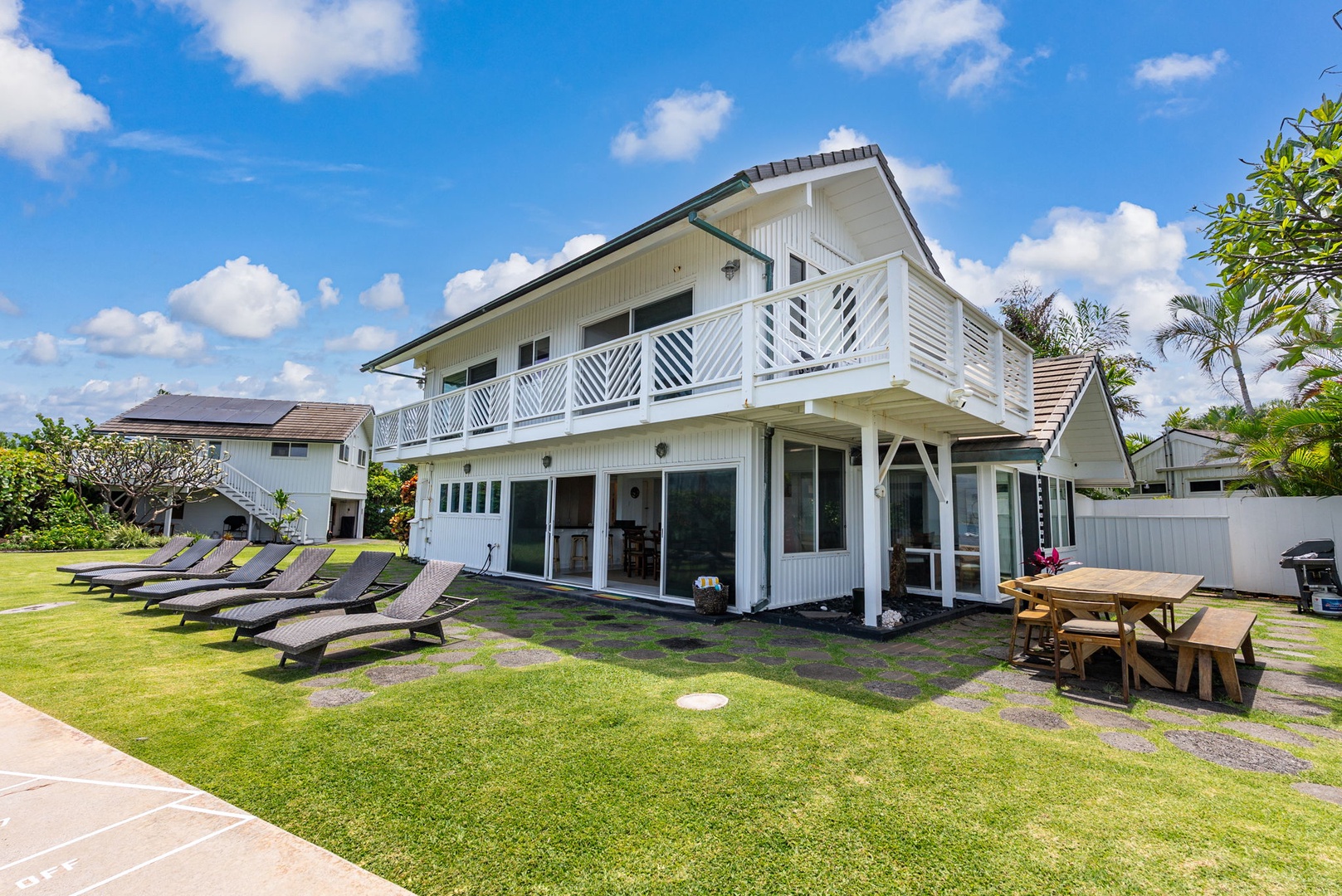Waianae Vacation Rentals, Ma'ili Blue Estate - Spacious outdoor areas with loungers and dining space for relaxation.