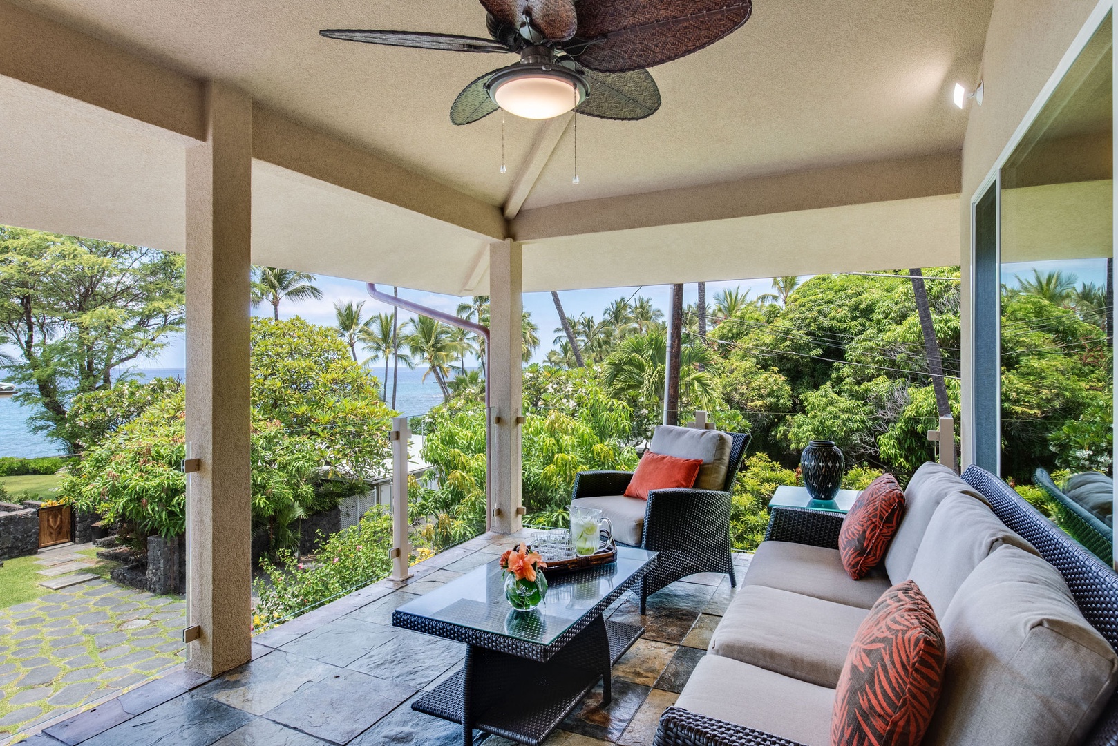 Kailua Kona Vacation Rentals, Kona Beach Bungalows** - Relax in Moku's lanai lounge, offering sweeping panoramic vistas for the ultimate serene experience.