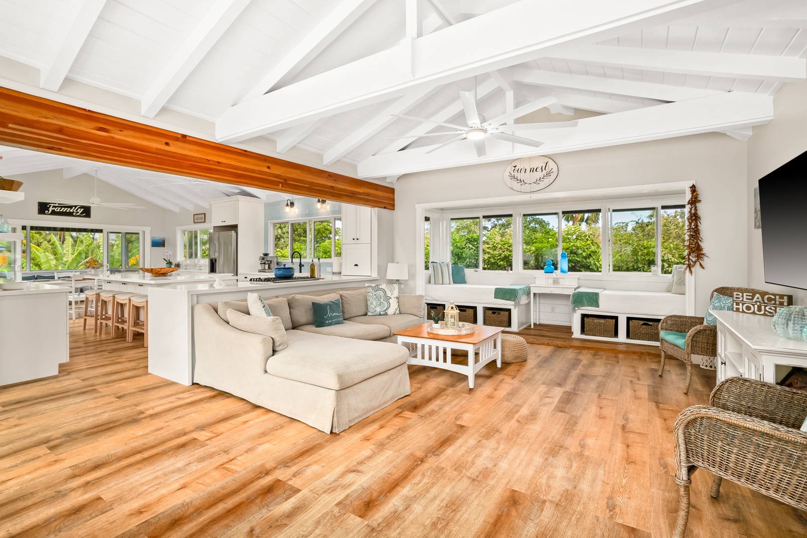 Princeville Vacation Rentals, Ola Hou - Entire Property - Spacious living area with vaulted ceilings, stylish furnishings, and large windows that bring the outdoors in.