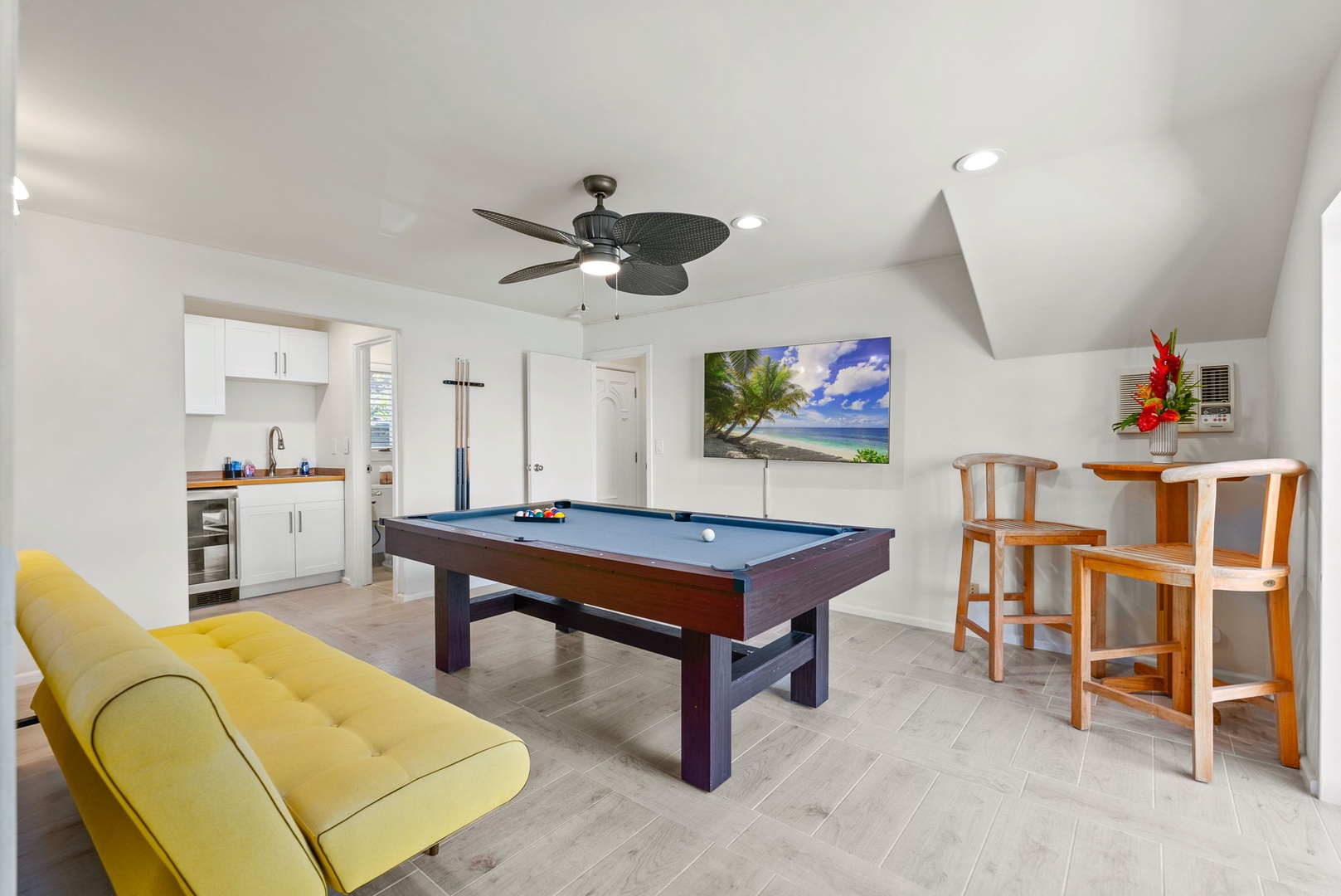 Honolulu Vacation Rentals, Wailupe Beachfront Getaway - Have fun in the expansive living area with a pool table and a sleeper sofa, makes the fifth bedroom of the home.