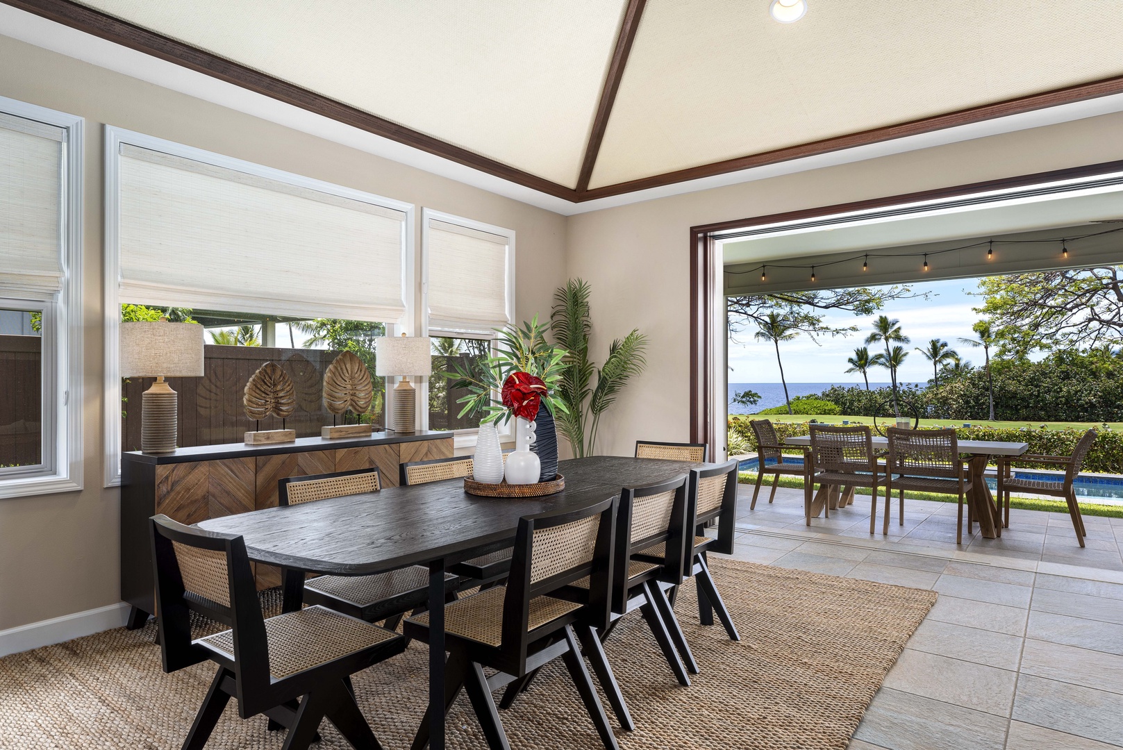 Kailua Kona Vacation Rentals, Holua Kai #27 - The lanai doors open onto dinner with the fairway greens filling the far end.