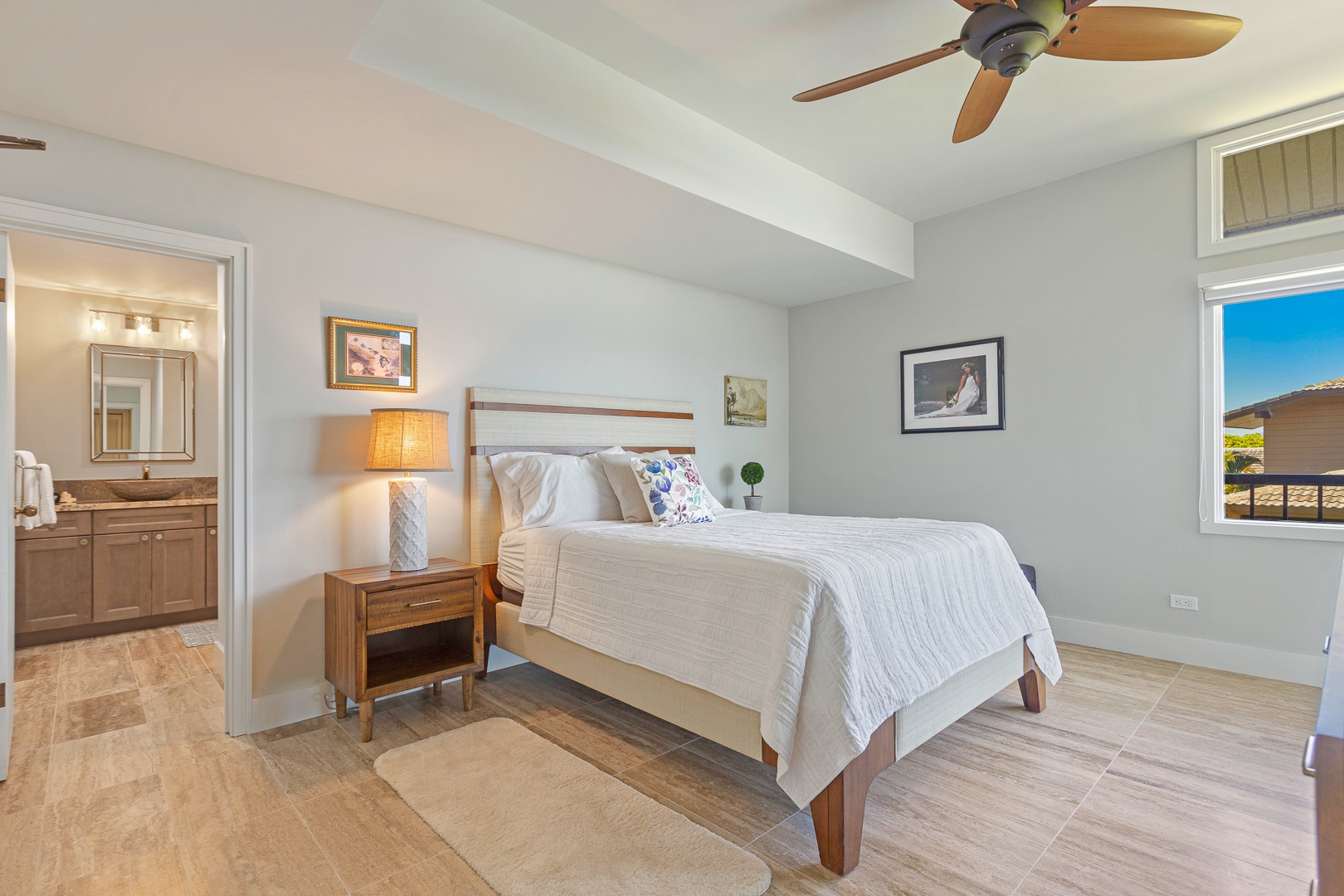 Lahaina Vacation Rentals, Kapalua Ridge 1622 - The second bedroom features a cozy queen-sized bed and a brand new ensuite bathroom with elegant tile flooring, providing a comfortable and modern retreat.