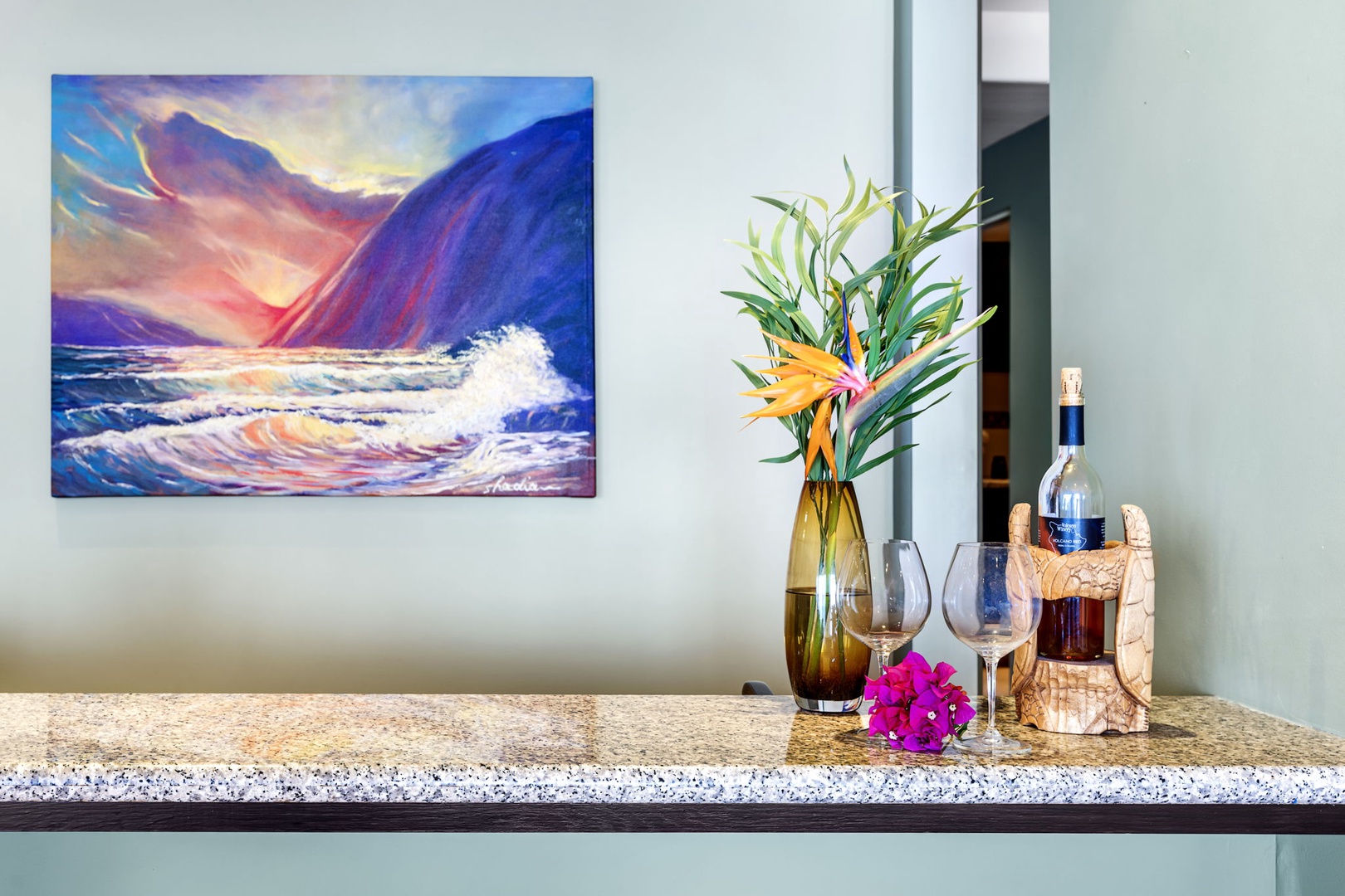 Kailua Kona Vacation Rentals, Hale Nai'a - Unwind with a glass of wine in your elegant space, where vibrant artwork and tropical flowers create the perfect ambiance for relaxation.