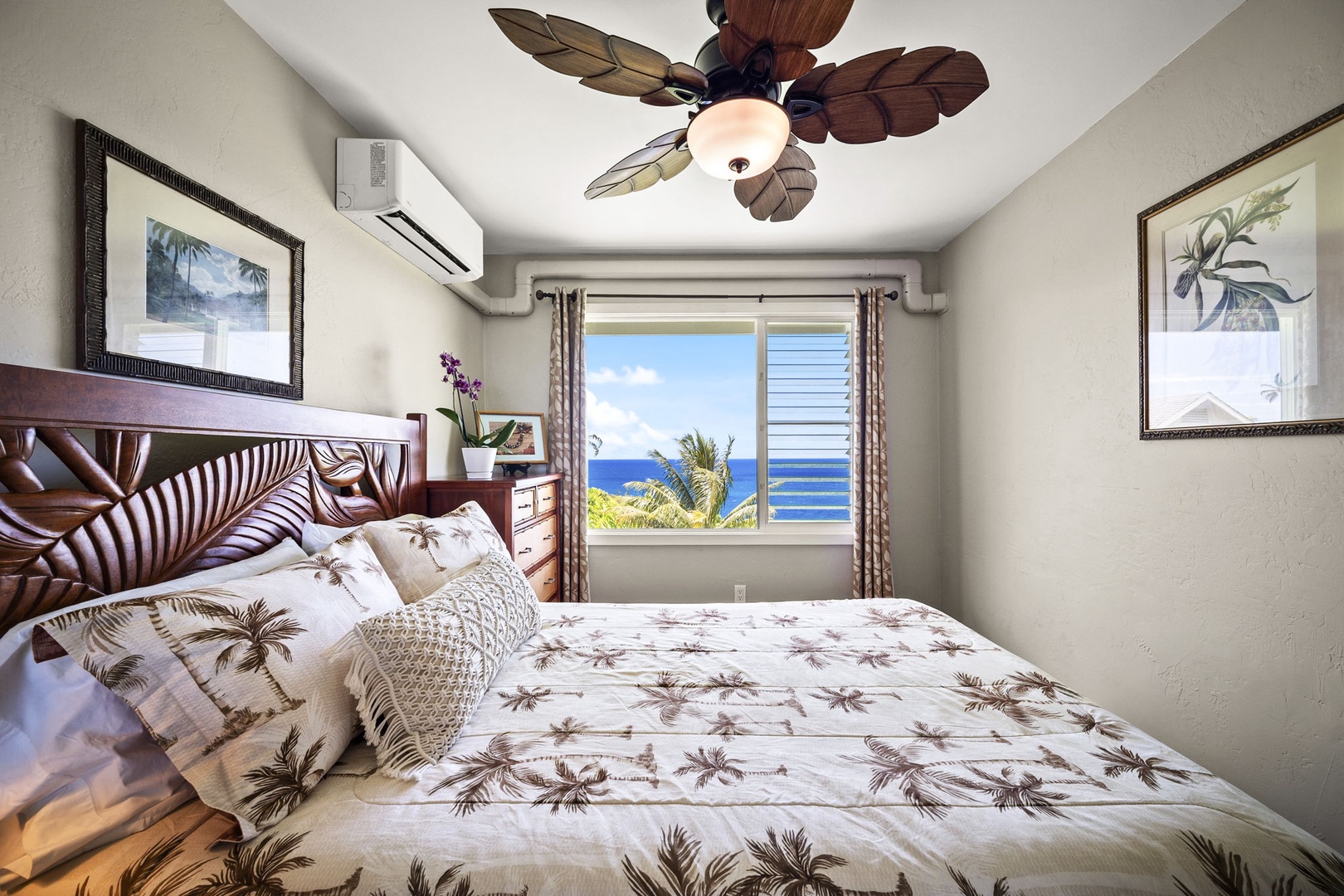 Princeville Vacation Rentals, Alii Kai 7201 - A ceiling fan overhead and the water out the window keep this bedroom easy.
