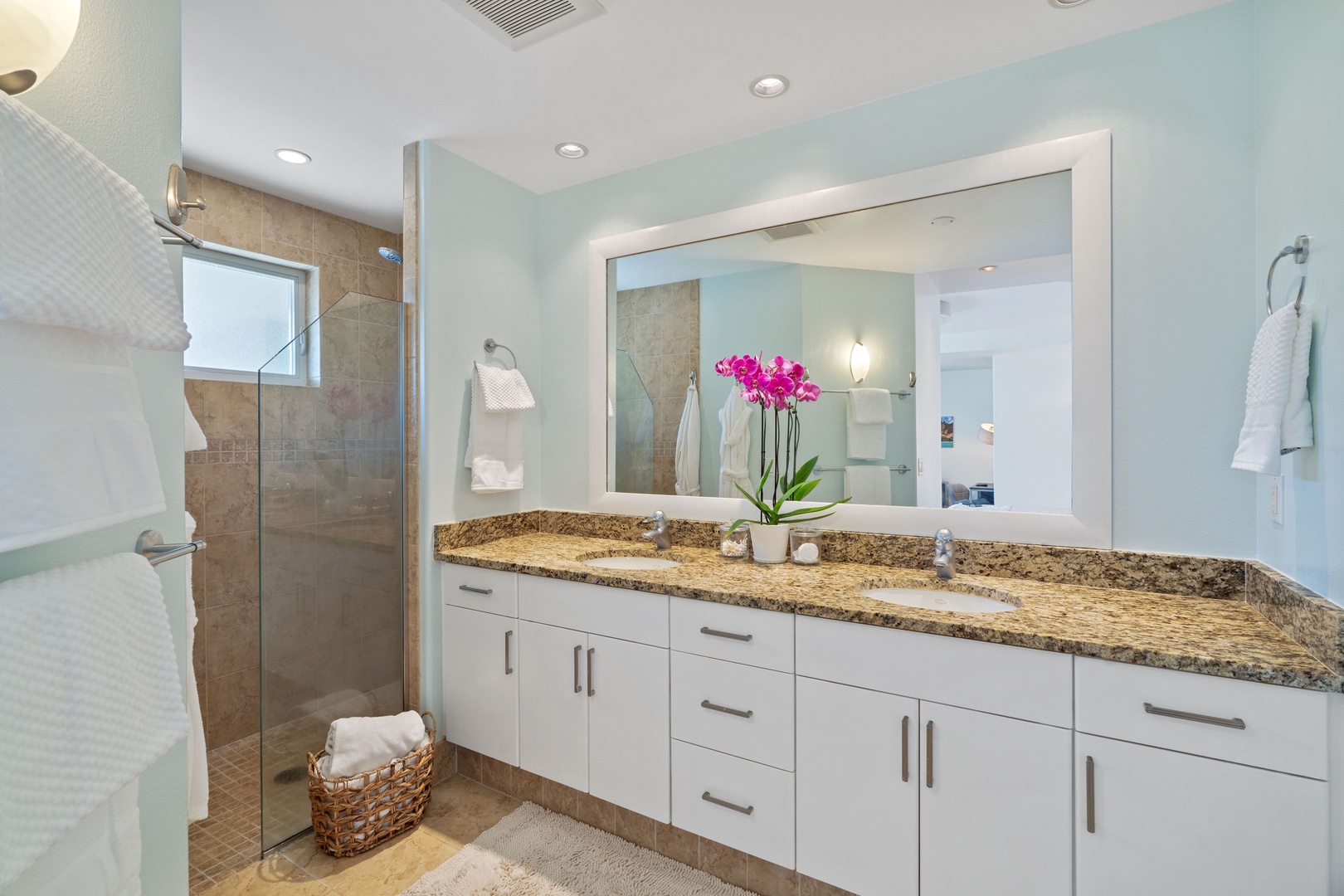 Princeville Vacation Rentals, Tropical Elegance - A beige-tiled floor gracefully complements the white cabinetry below the sink.