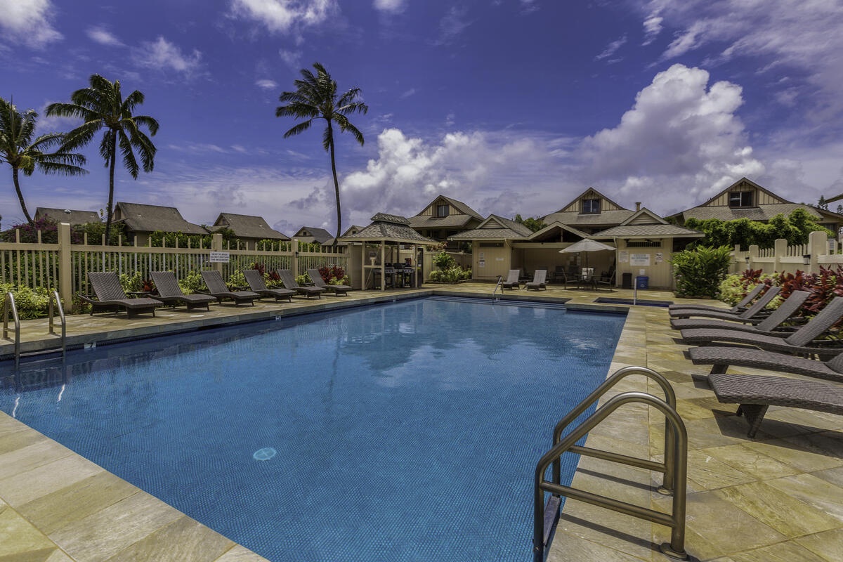 Princeville Vacation Rentals, Hale Ho'omaka Studio - Soak in the sun and island breezes from one of the many loungers at the Sandpiper Village pool.