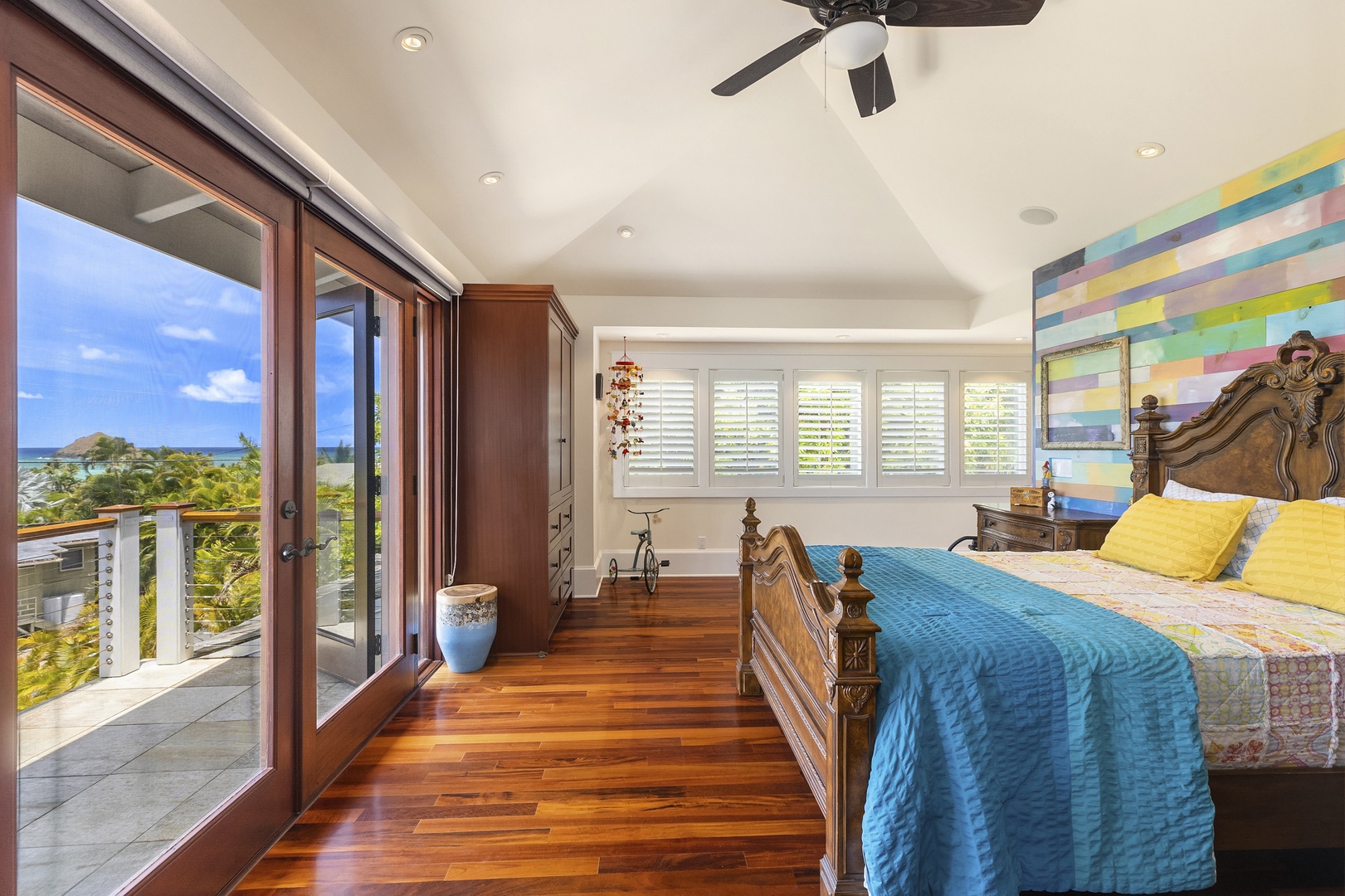 Kailua Vacation Rentals, Lanikai Villa** - Guest Bedroom 2 is furnished with a king bed, ocean views, split A/C, ceiling fan, and ensuite bath.